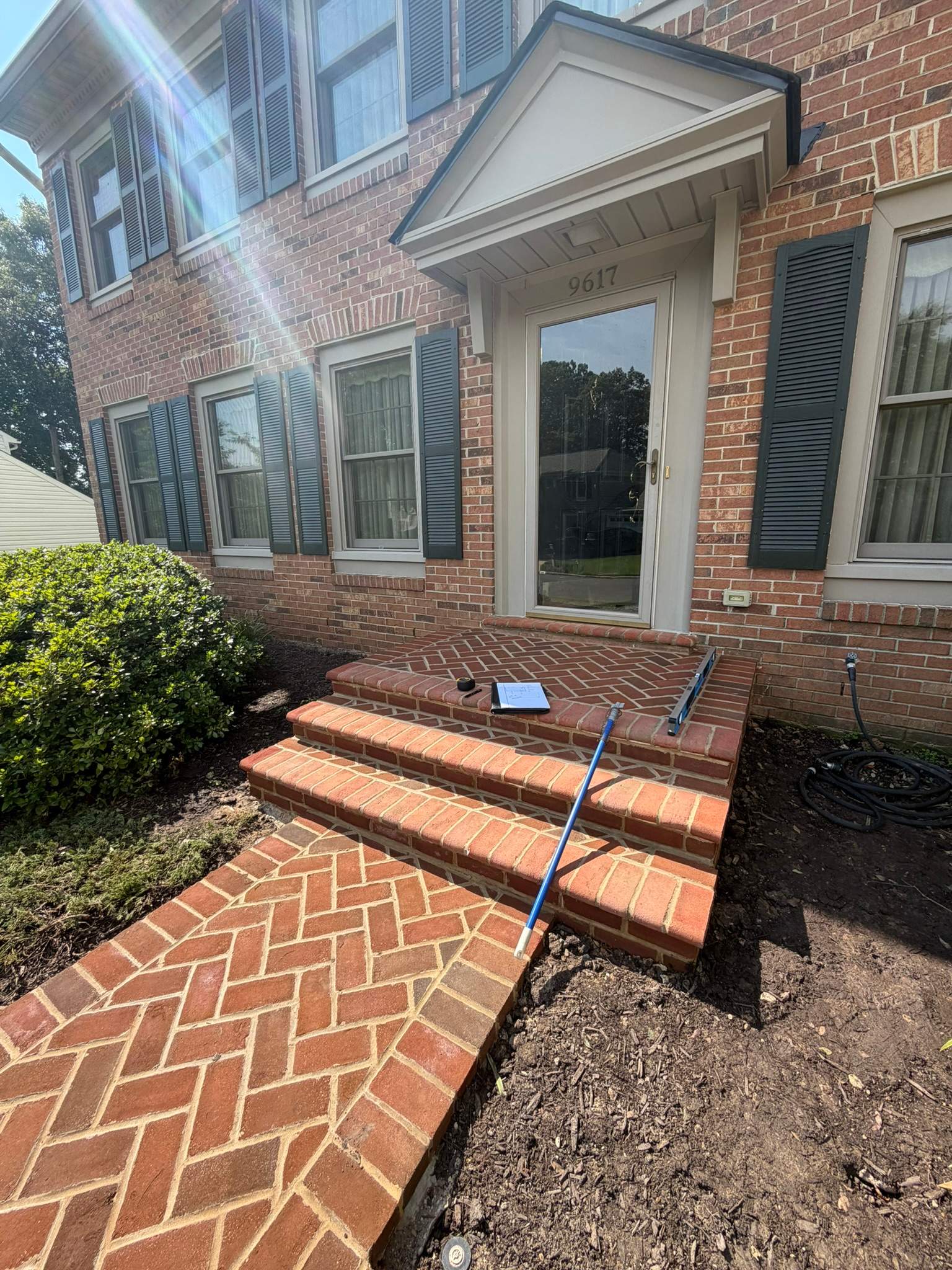 Custom Exterior Handrail Installation on Brick Entryway in Fairfax Station by Capitol Iron Works