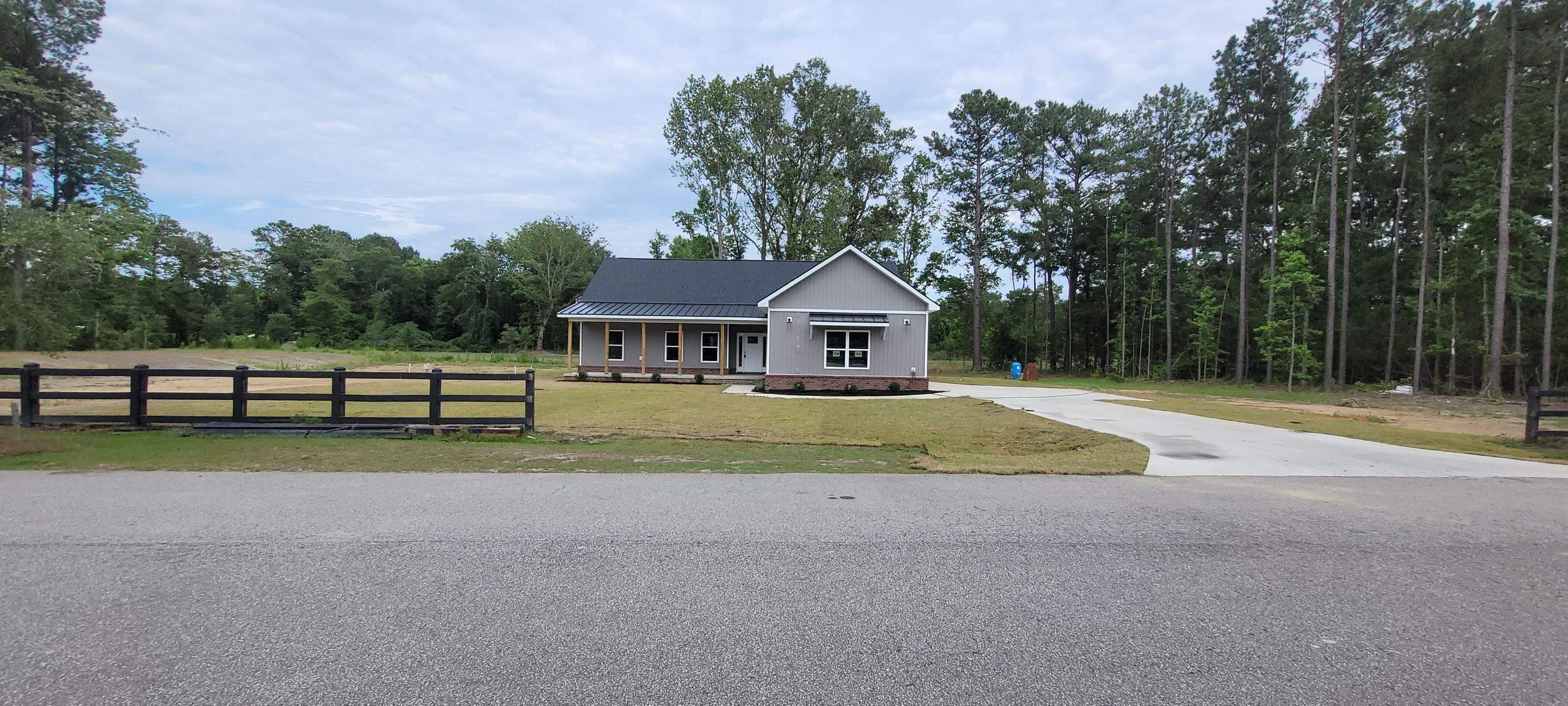 New Home Construction using brick and vertical vinyl by Cornerstone Home Builders, LLC