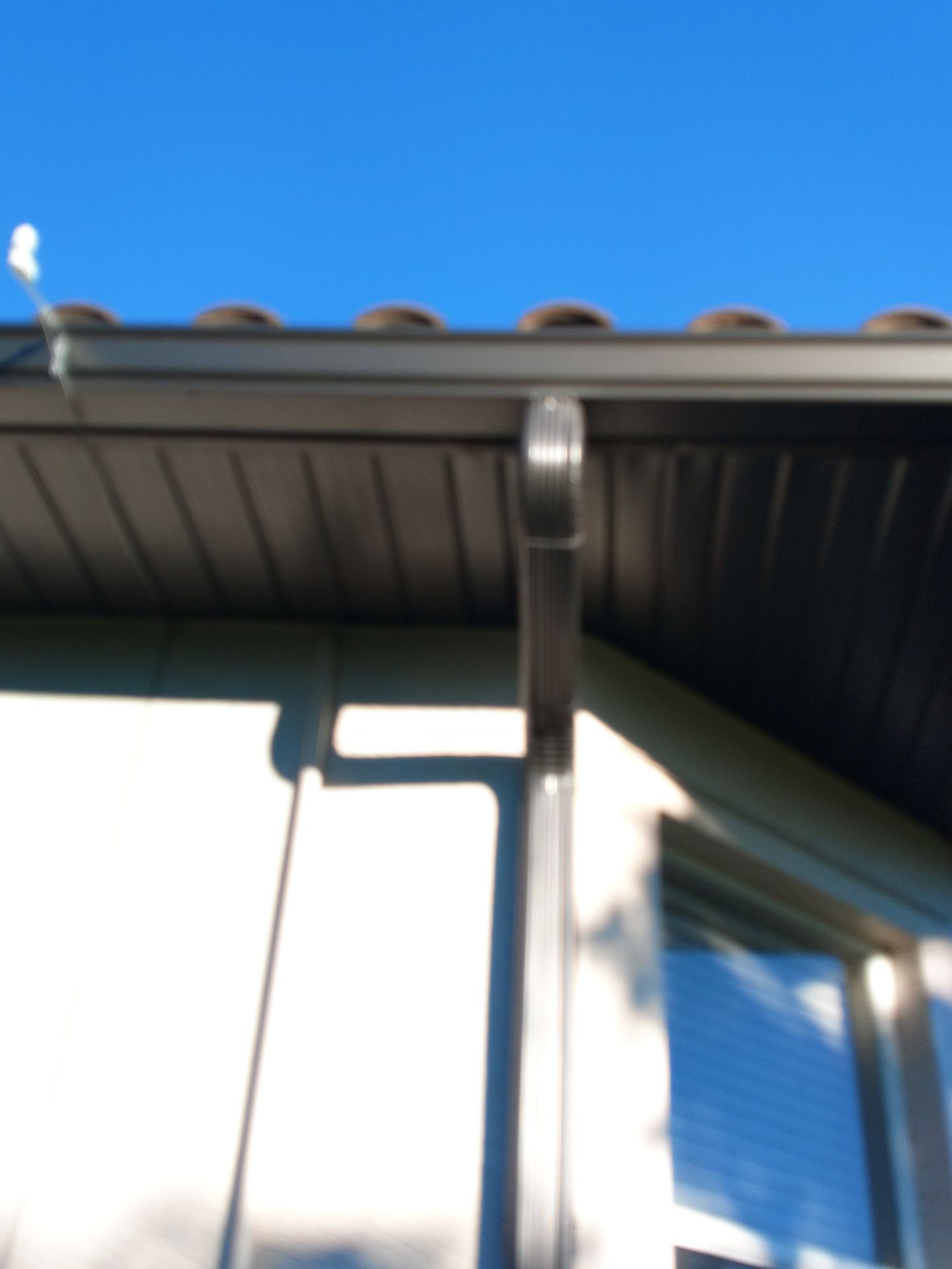 Dark Bronze Soffit Installation in Sarasota FL by Gutter Professors