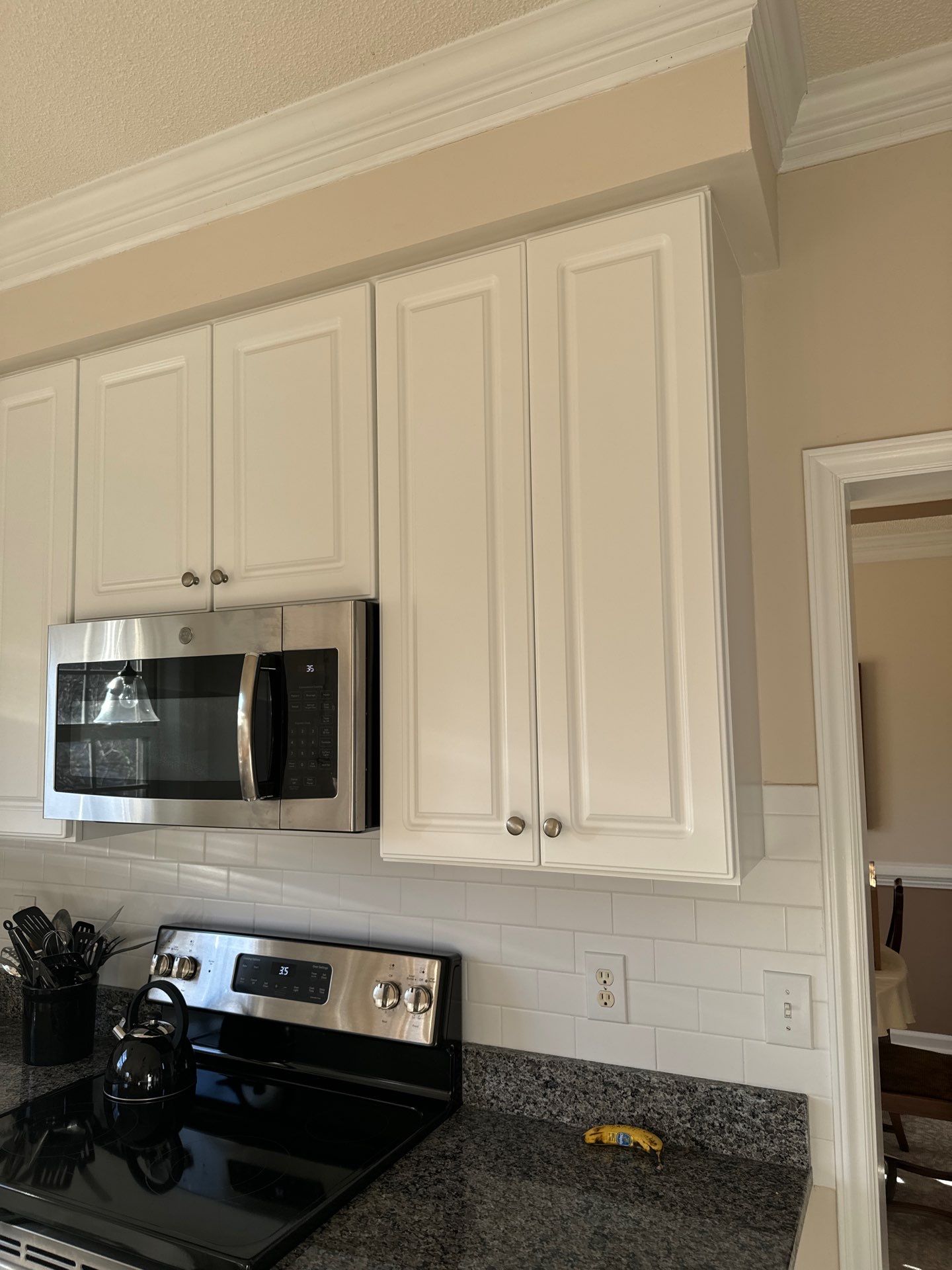 Cabinet painting by GonzalezPainters & Contractors Inc 