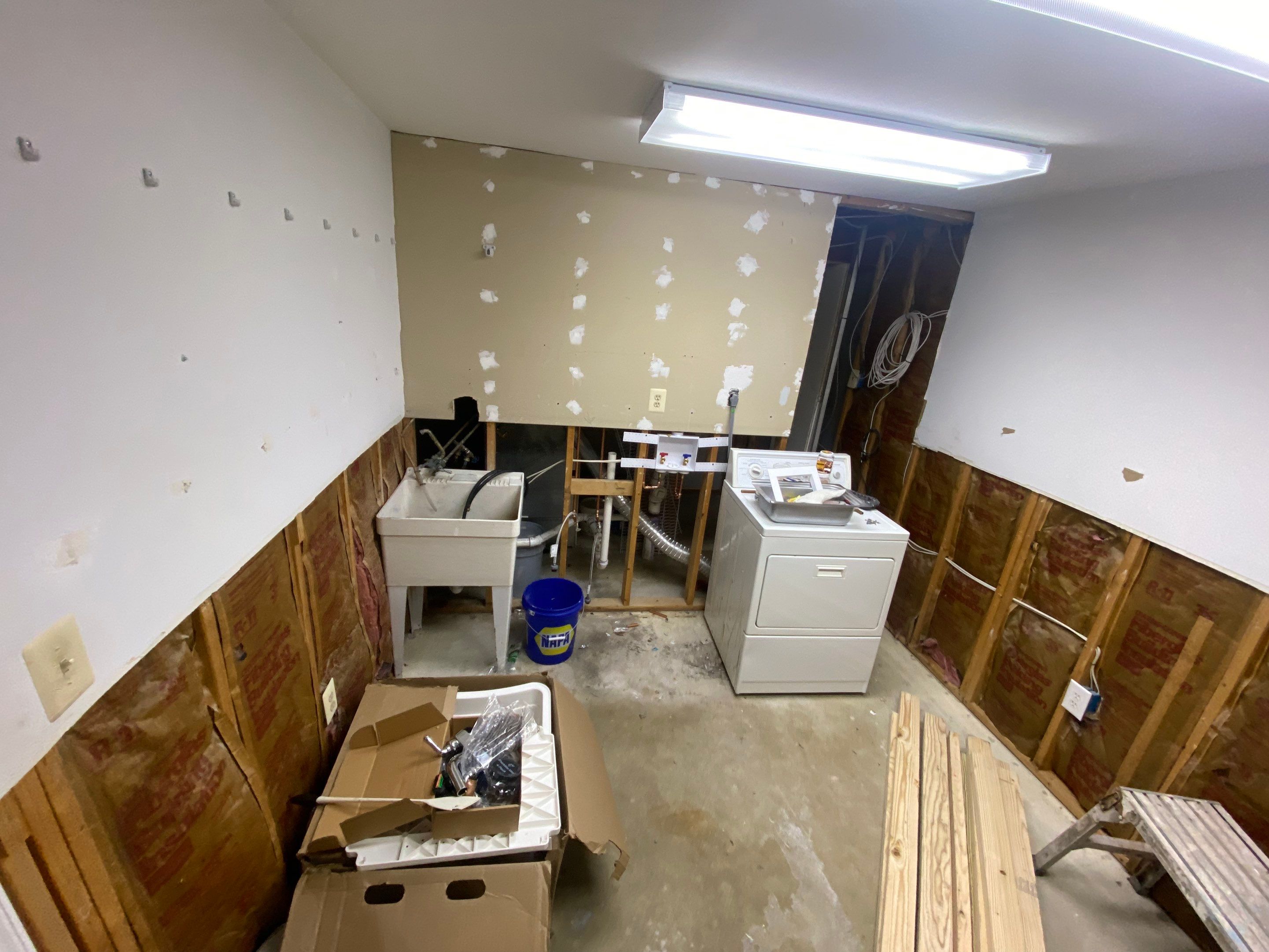 Laundry Room Redmodel using Lifeproof Luxury Vinyl Plank Flooring by The Smet Companies, LLC