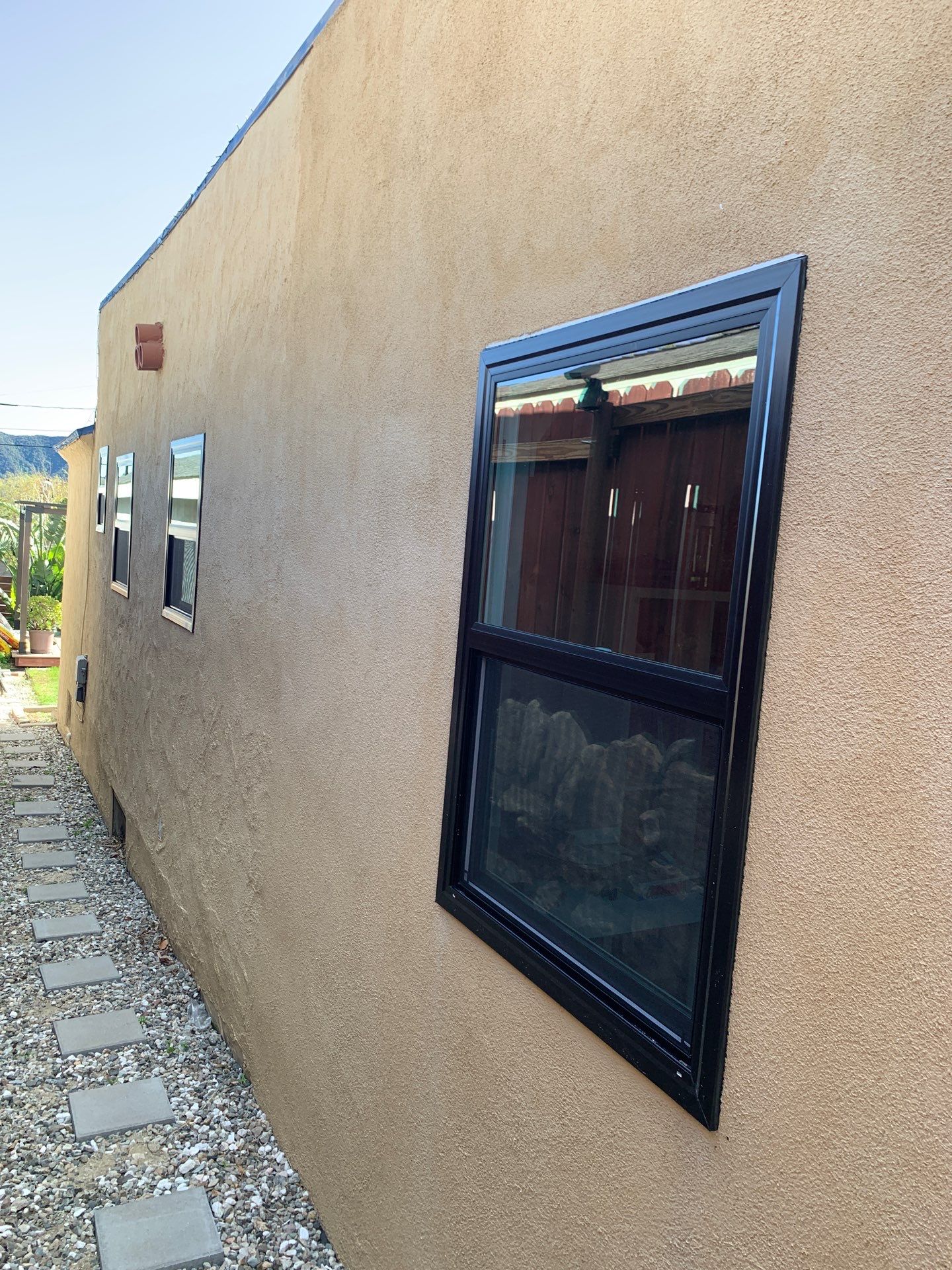 Window Installation using Black Anlin windows by American Window Company