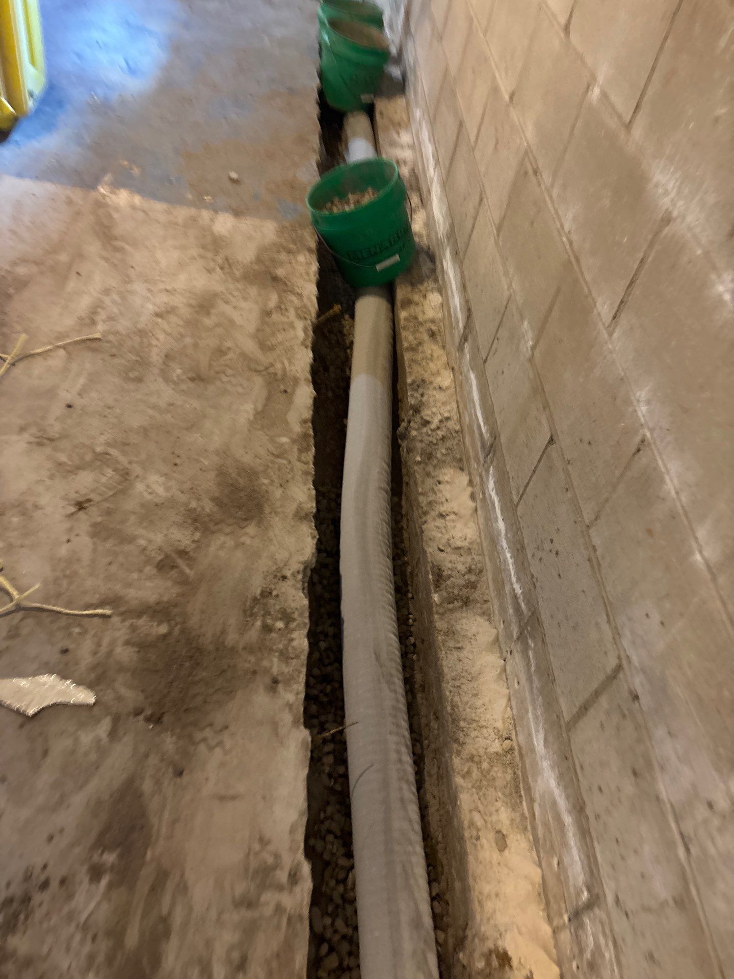 Interior Drain Tile & Buried Discharge in South Minneapolis by Waterproofing Northeast