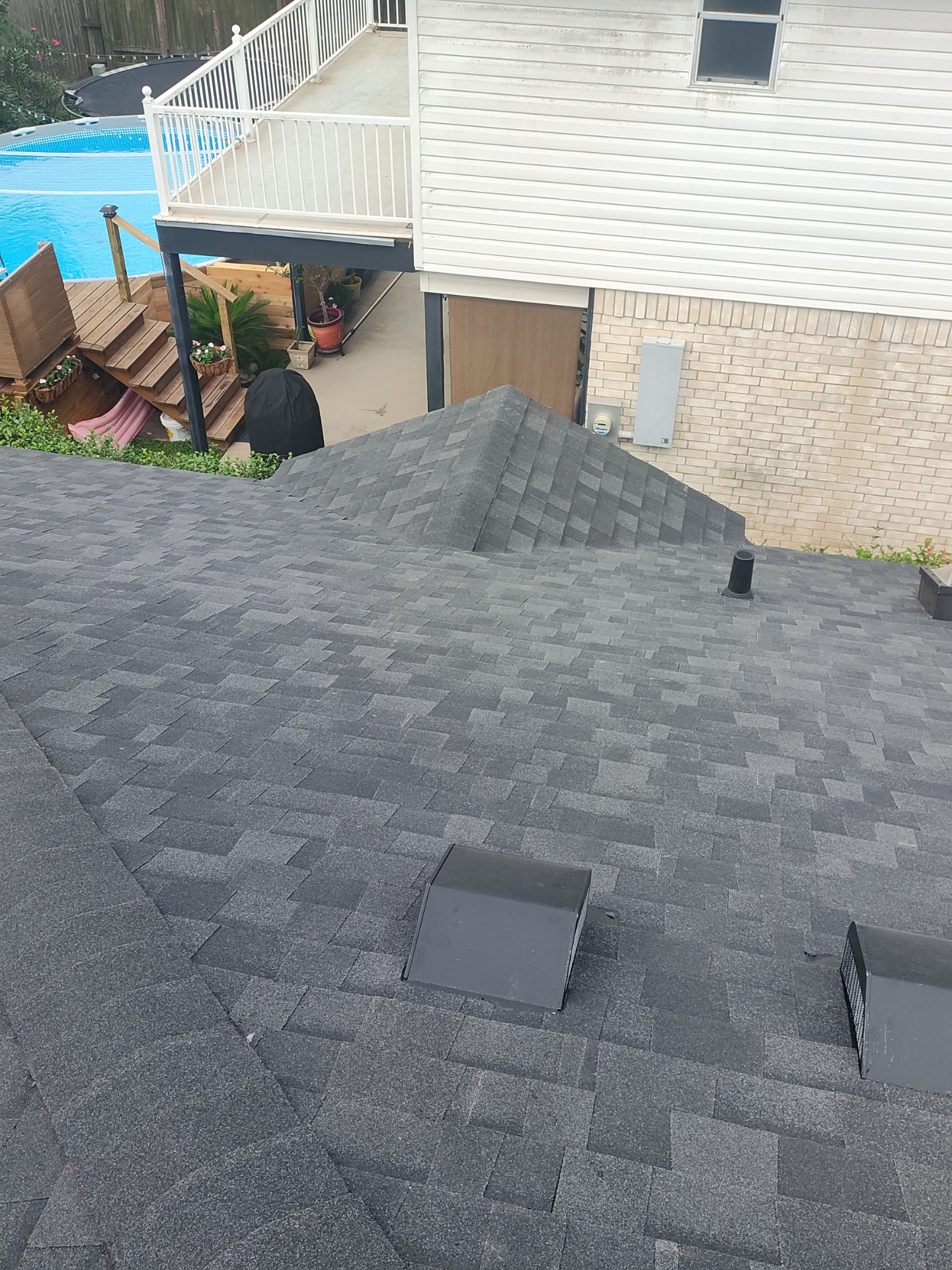 Nothing looks nicer than a little black roof by Bayfront Roofing and Construction