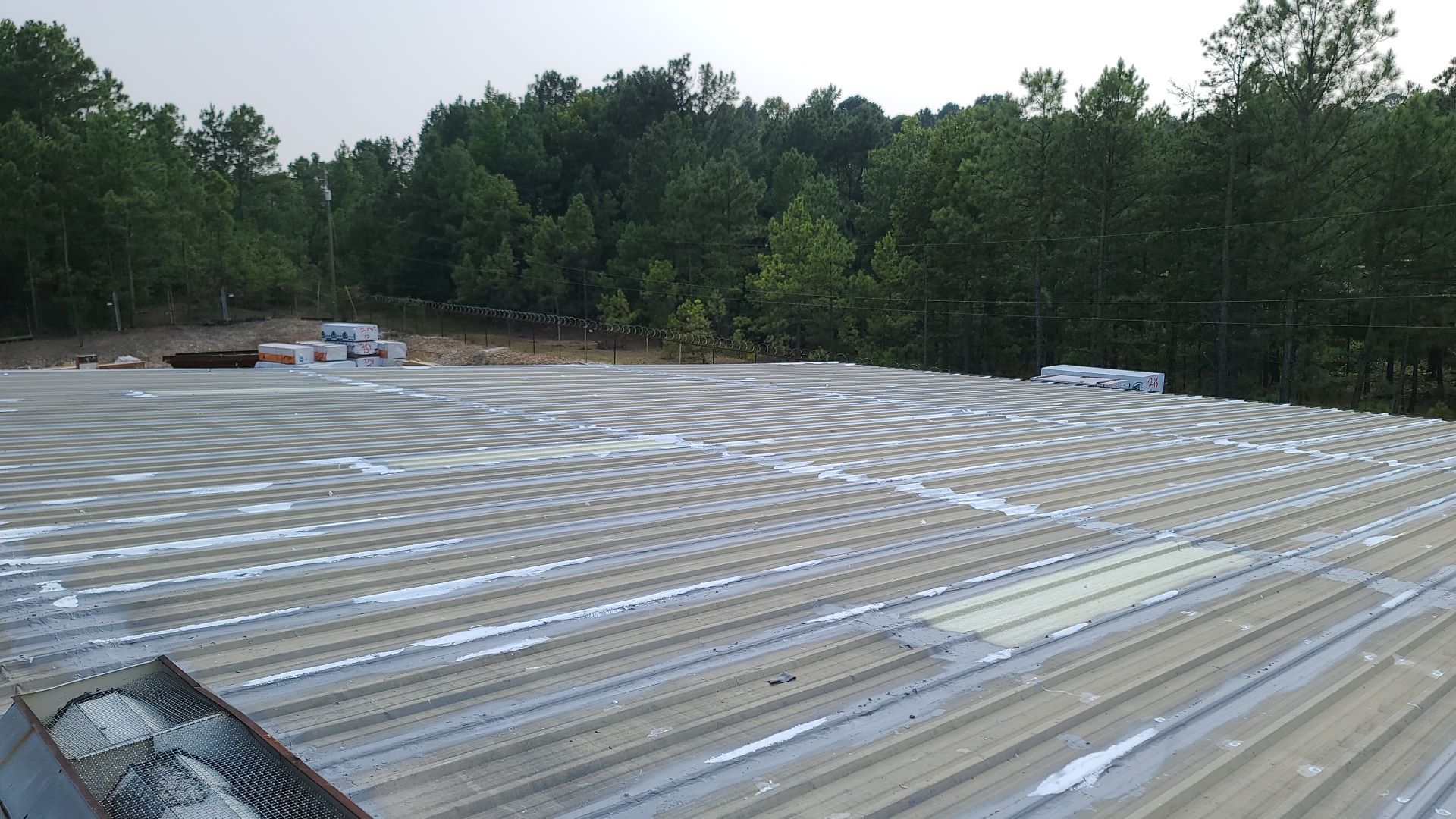 Commercial Roofing Installation using Aldocoat Coatings by Hostetler Roofing