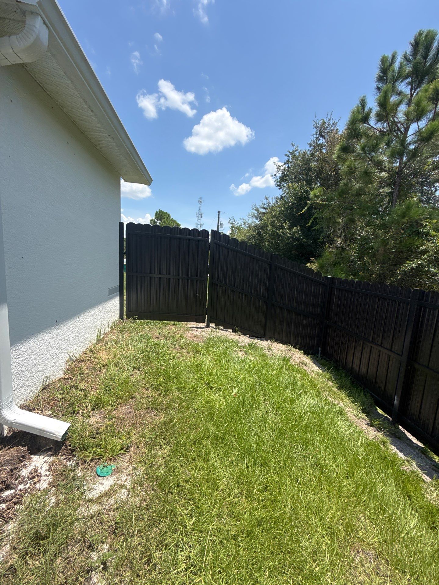 Black Scalloped Metal Privacy Fence Installation in Punta Gorda by True Fence LLC