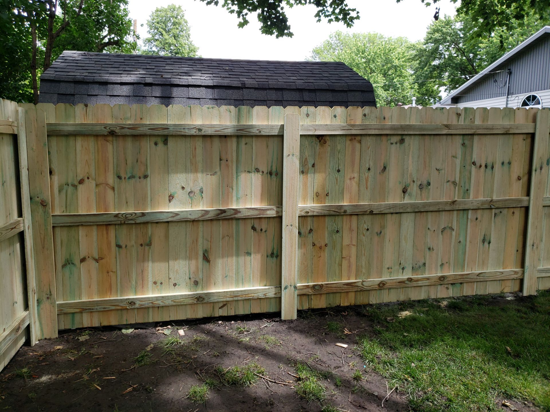 Custom Wood Privacy Fence Installation for Charles City Backyard by Perfect Picket Fence and Stain