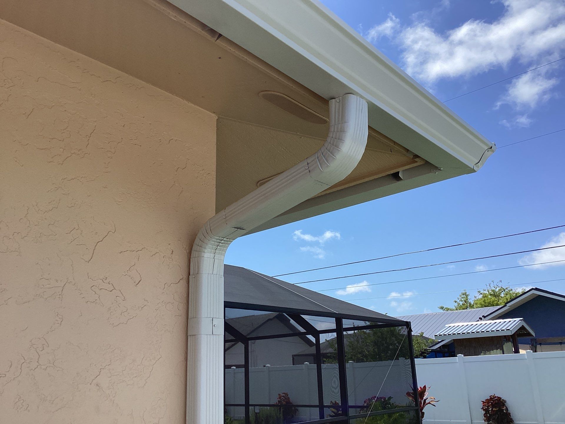 White K Style Seamless Gutters using 3X4 Elbow Downspout in Cape Coral FL by Gutter Professors