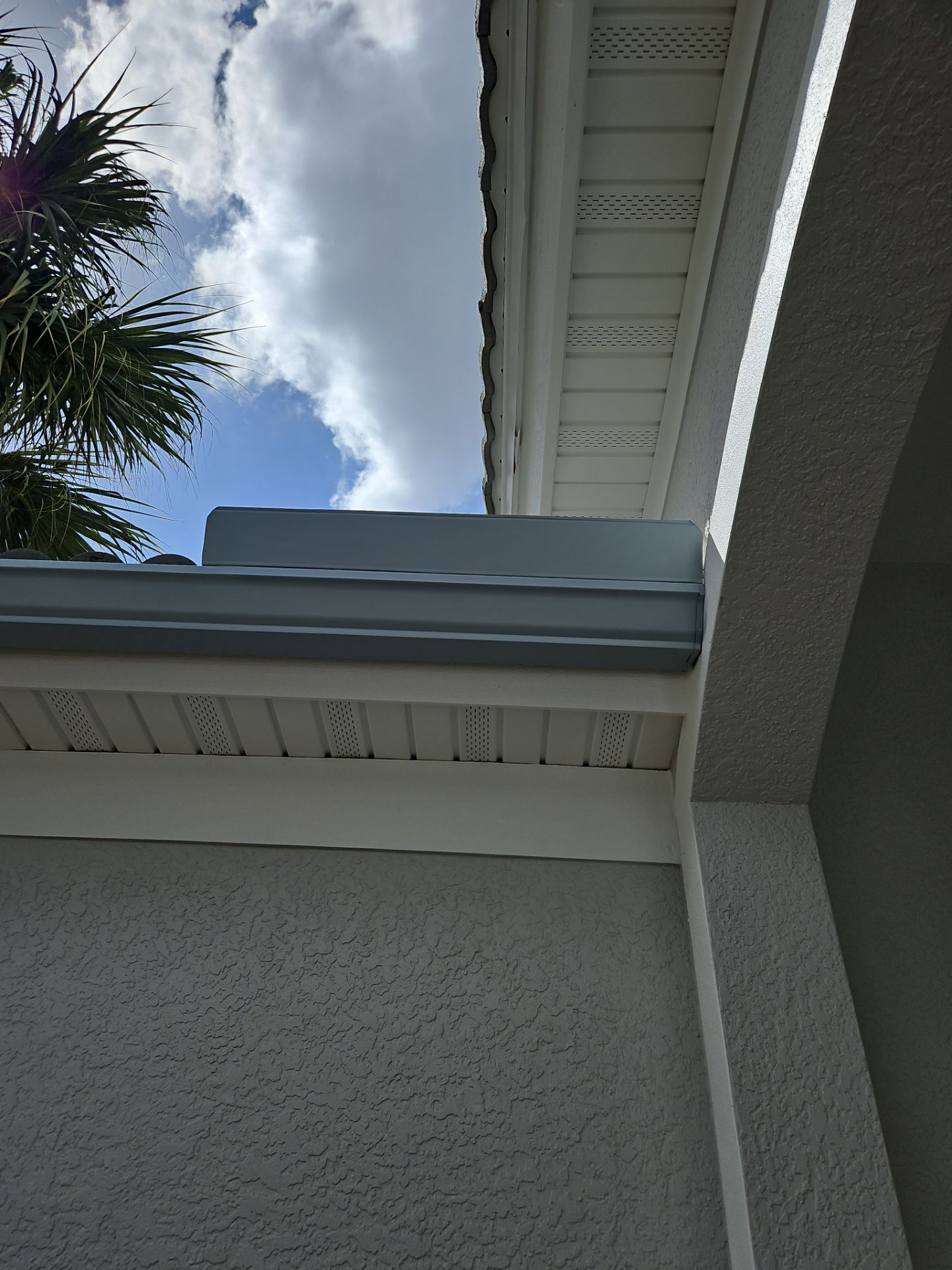 6-inch K-style Seamless Gutters and Splash Guard in Grey Color in Naples FL by Gutter Professors