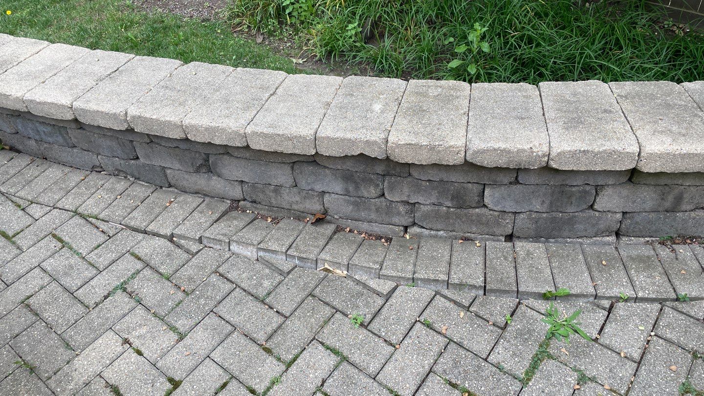Brick patio repair, clean sand and seal by Northern Power Washing LLC.