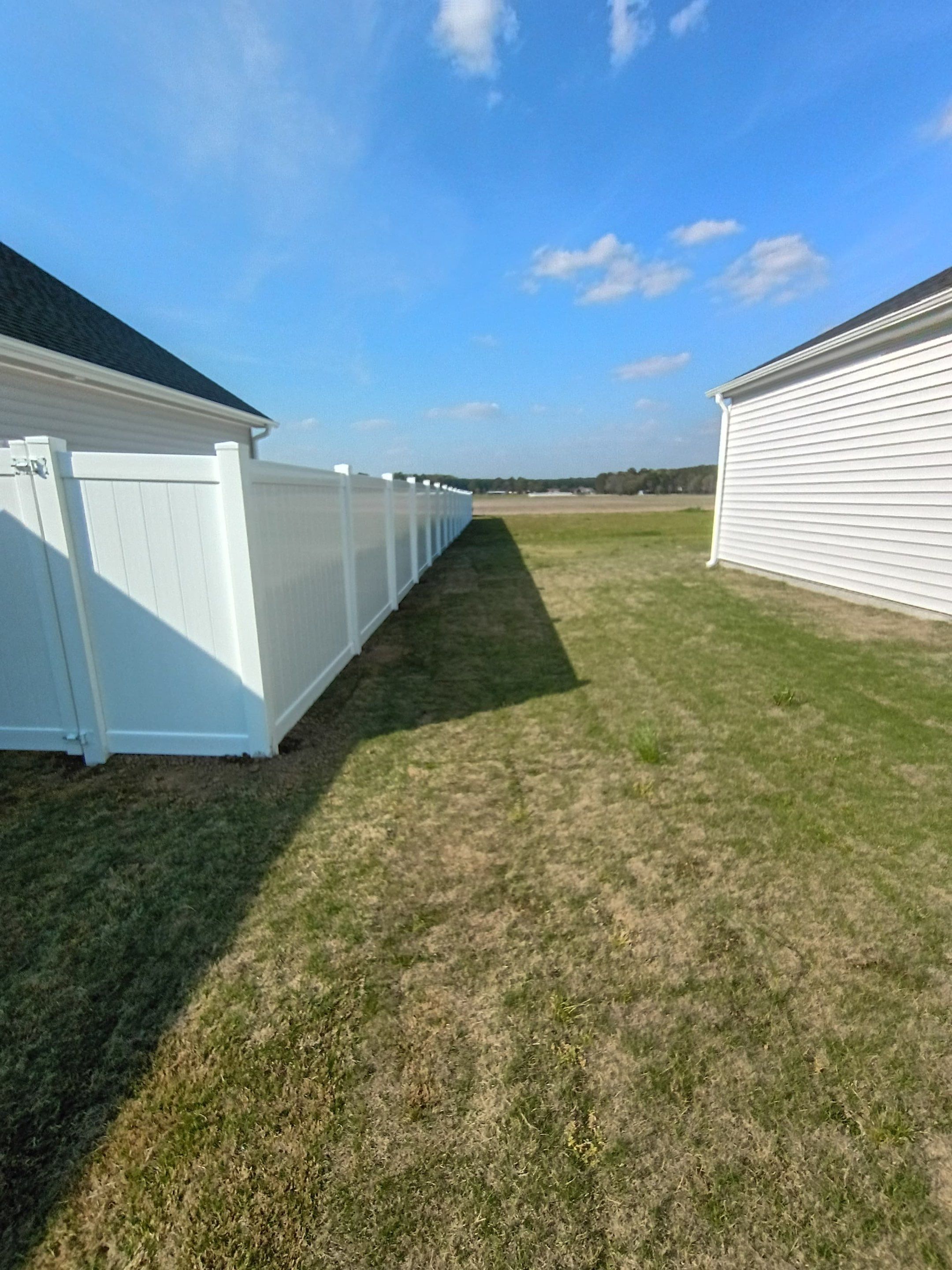 White Vinyl Privacy Fence Installation in Ayden, North Carolina by Superior Fence and Rail