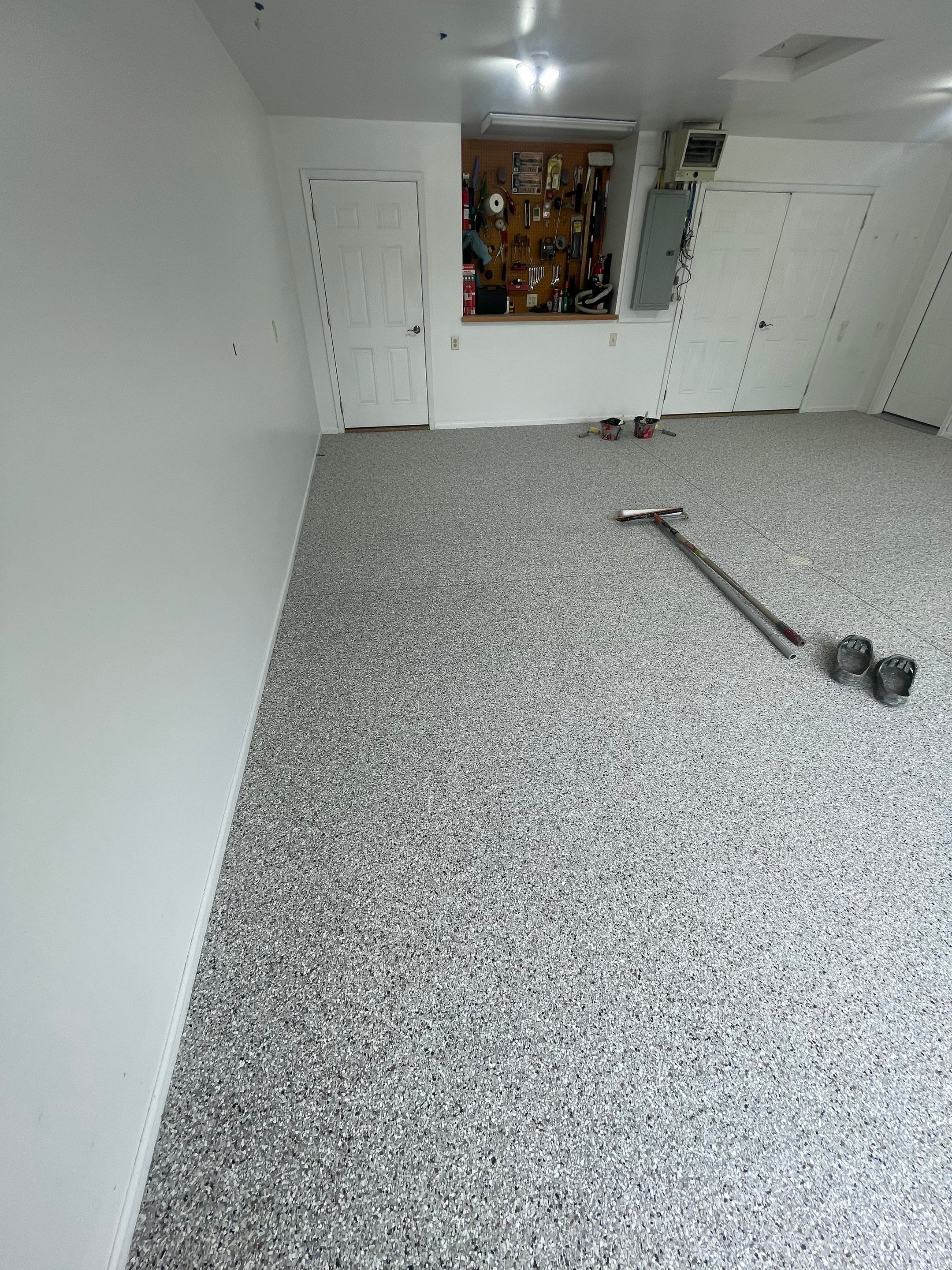 Coyote Flake Garage Floor Coating in Worthington, Minnesota by Select Painting, Coatings & Garage Cabinets