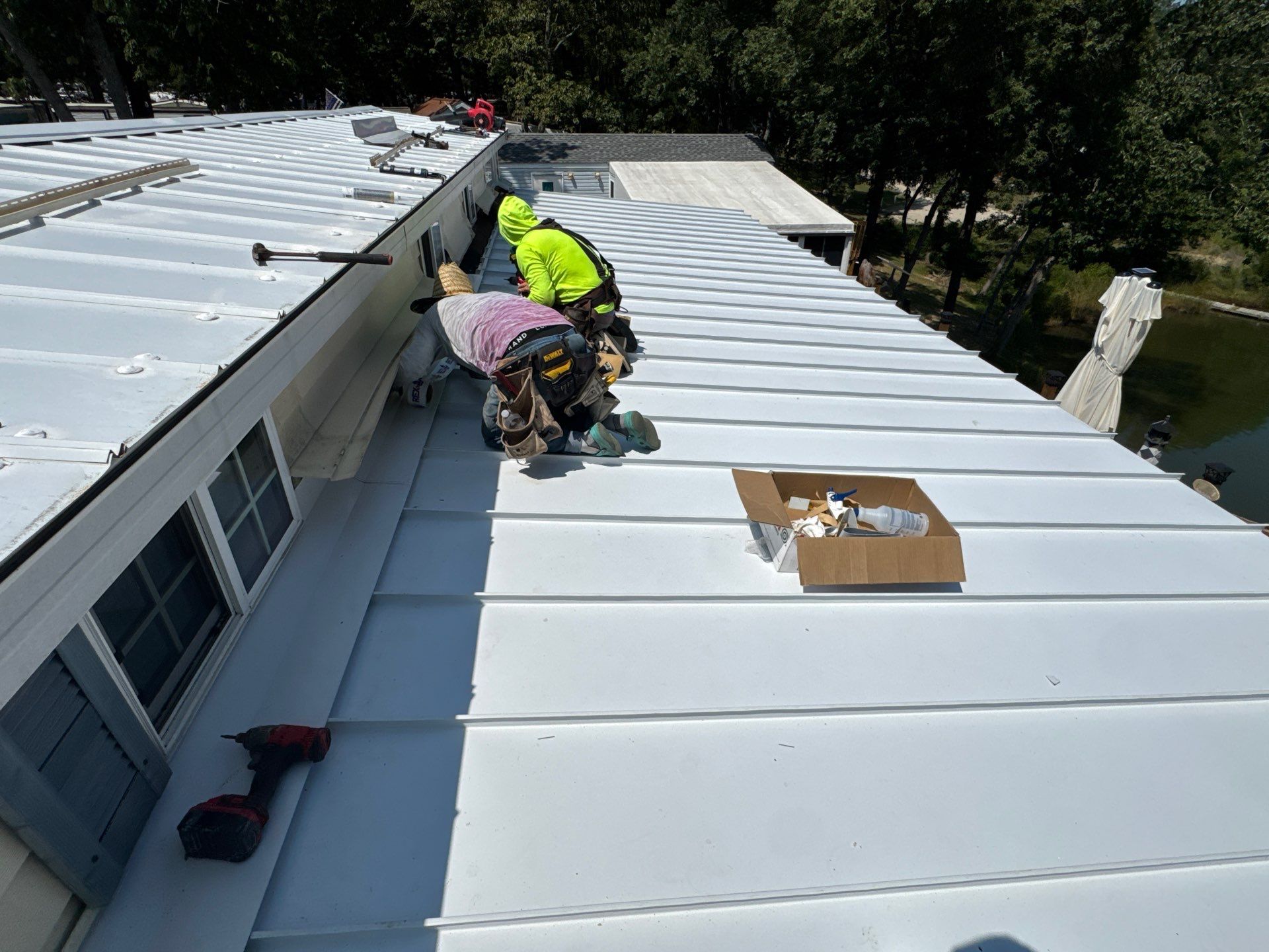 White Standing Seam Metal Roof Installation in Wake, VA by Cade Construction
