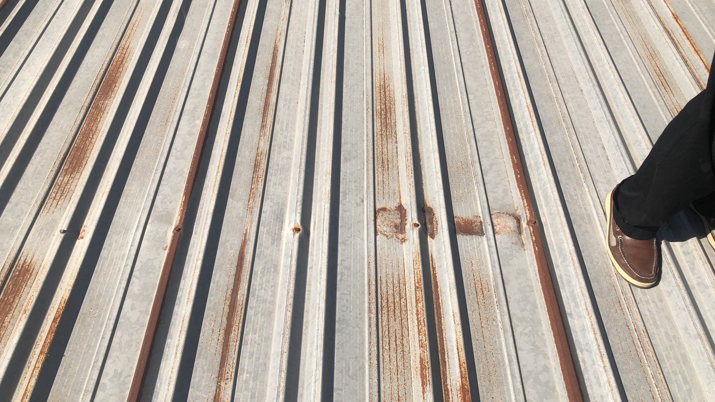 Metal Restoration Roofing system with Benchmark/PUMA XL 20 yr warranty by Straight Edge Roofing Inc