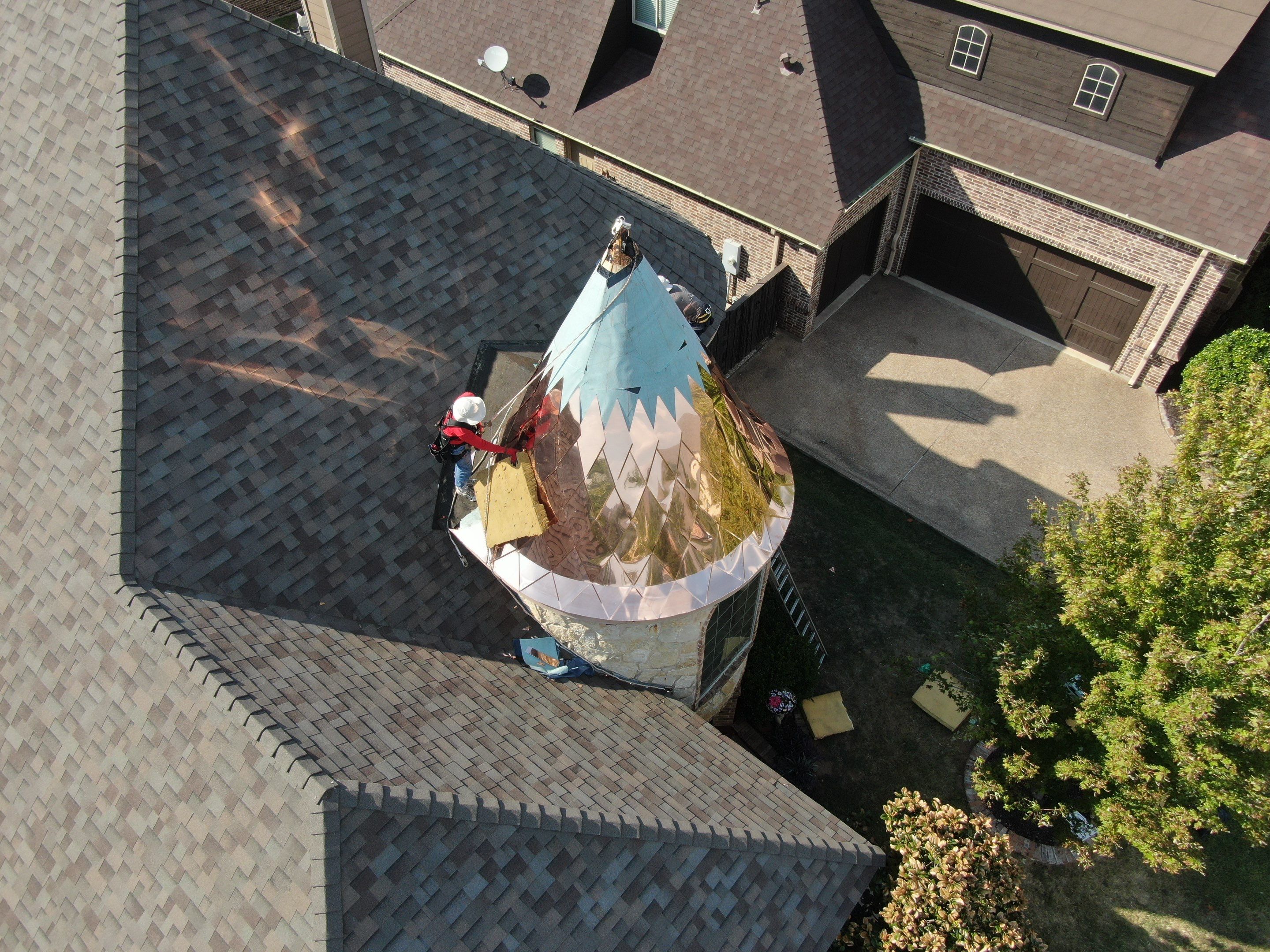 Installing Custom copper turret and Malarkey Vista Class 4 shingles Hail Damage Upgrade by Becker Roofing and Exteriors
