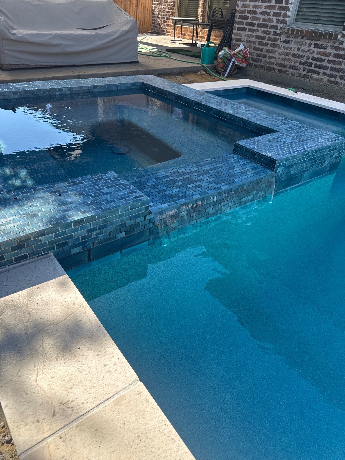 Geometric Pool with Raised Stone Spa by Pinnacle Pools and Spas - DFW
