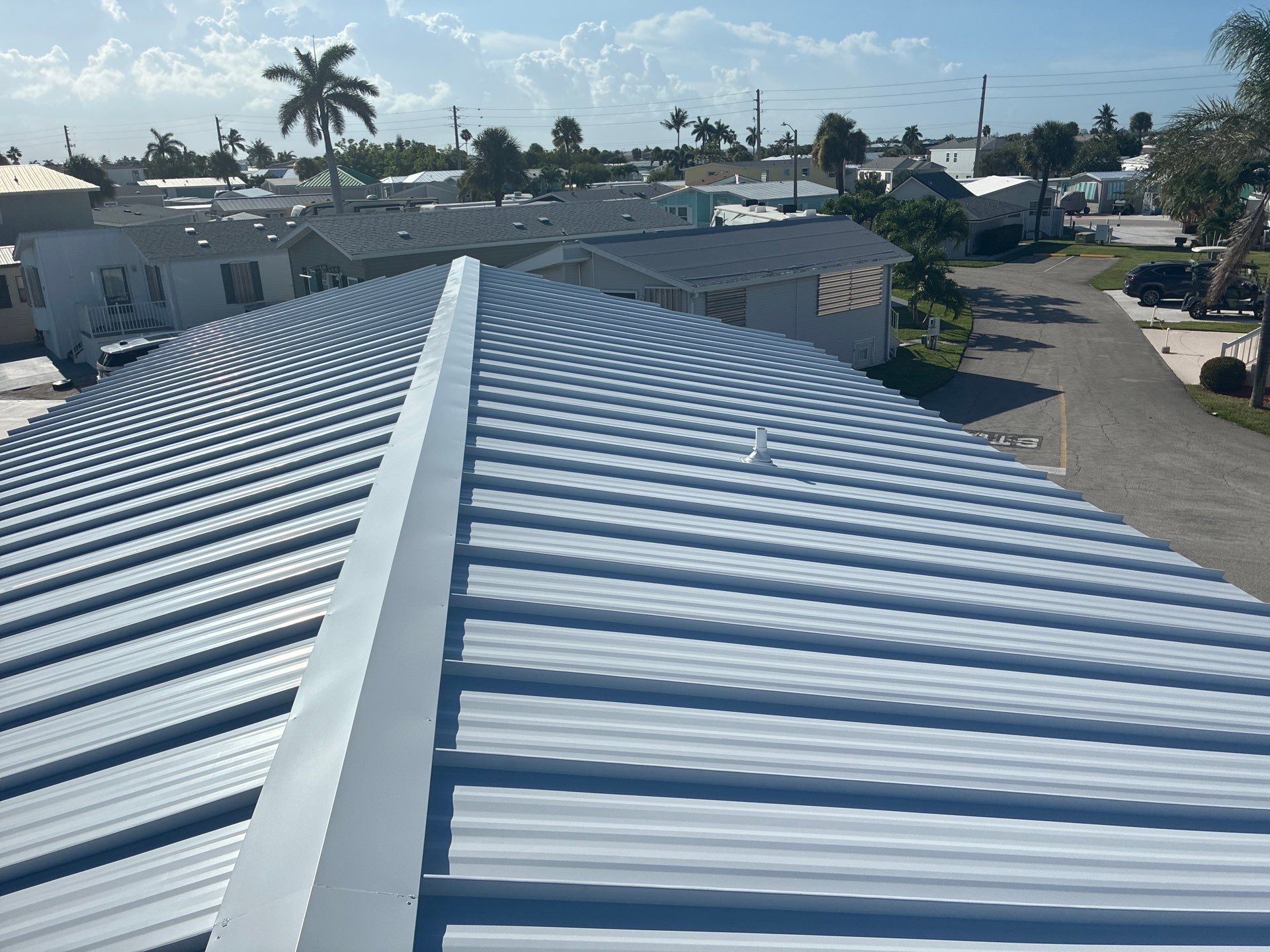 .032 Aluminum 1.5" Mechanical Seam Regal White  by Total Roofing System The Metal Roof Experts