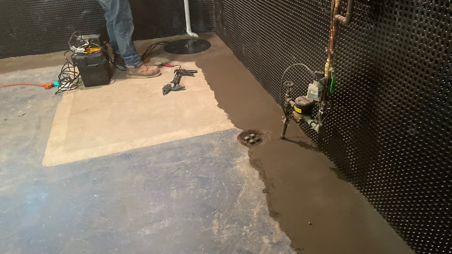 Interior Drain Tile & Buried Discharge in South Minneapolis by Waterproofing Northeast