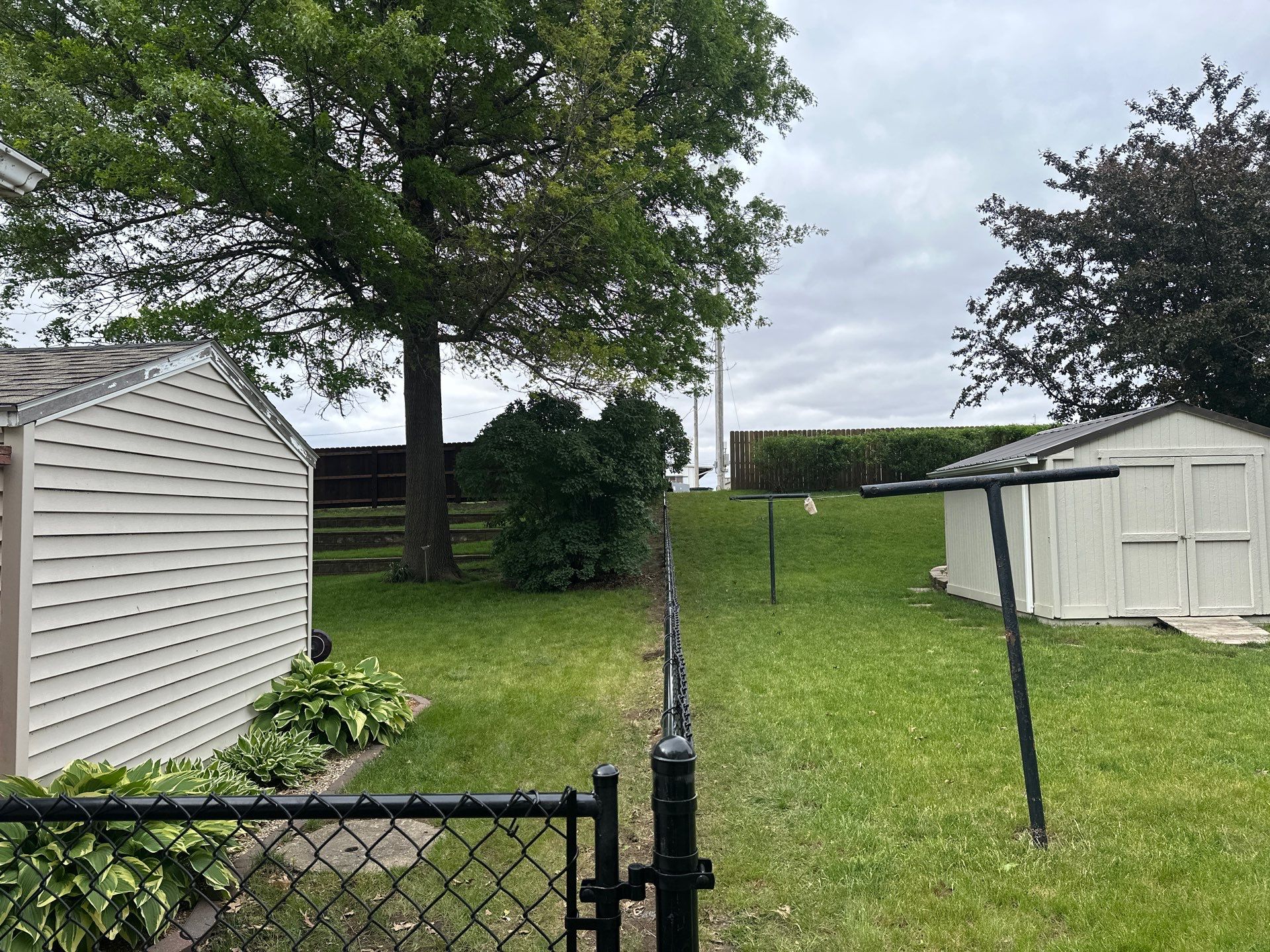 Chain Link and Cedar Privacy in Grundy Center by Perfect Picket Fence and Stain