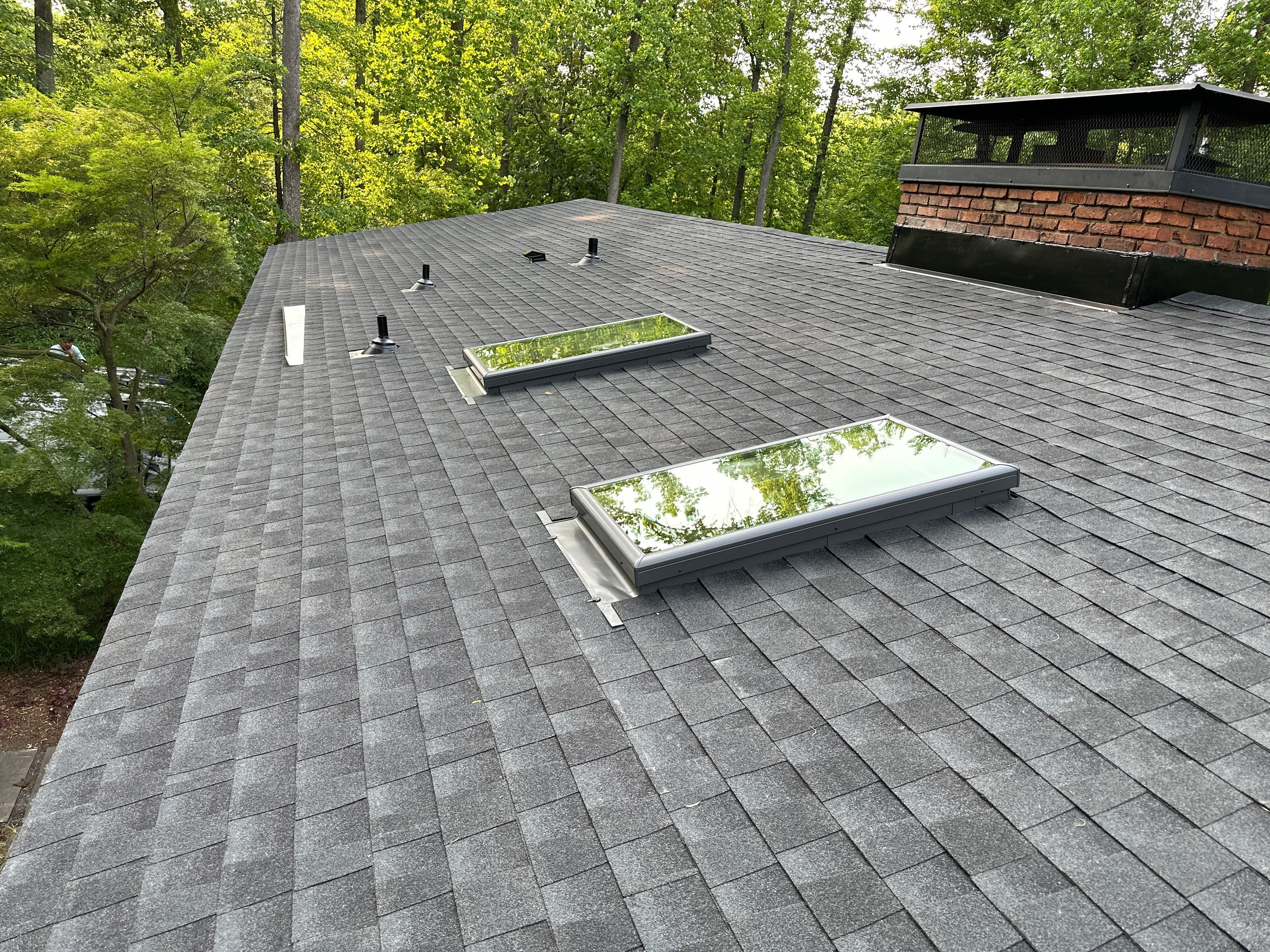 Acorn Deck House Roof Replacement + Skylight Addition by American Home Contractors