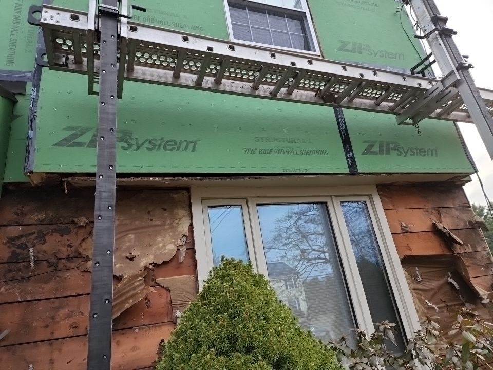 James Hardie siding, new metal roof and couple windows being installed. by UBrothers Construction