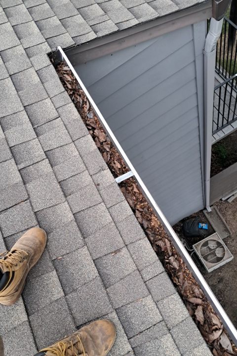 Commercial gutter cleaning Modesto, CA before photo with filled gutters