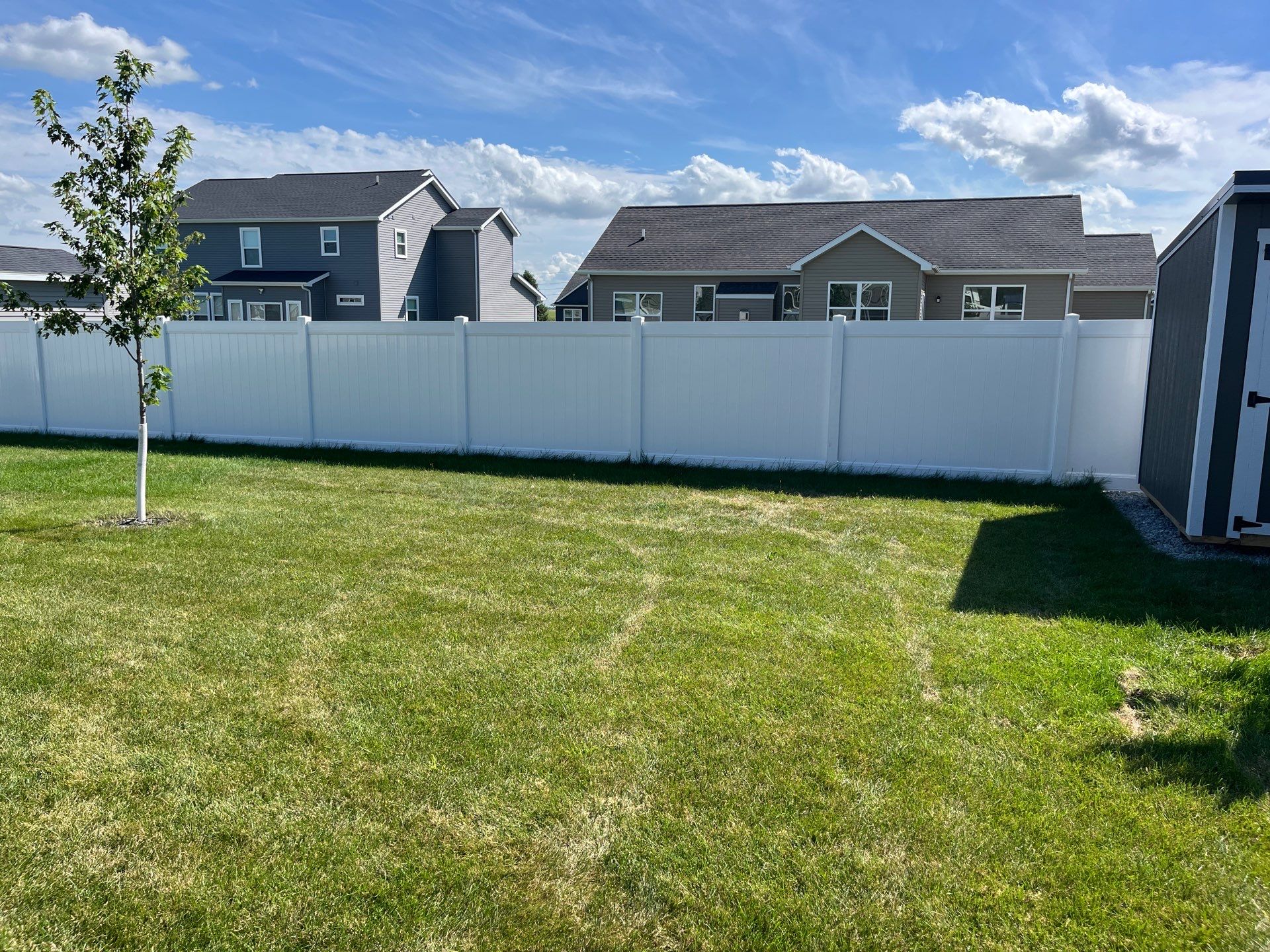 New Vinyl Privacy Fencing and Gates for Waterloo Residential Backyard by Perfect Picket Fence and Stain