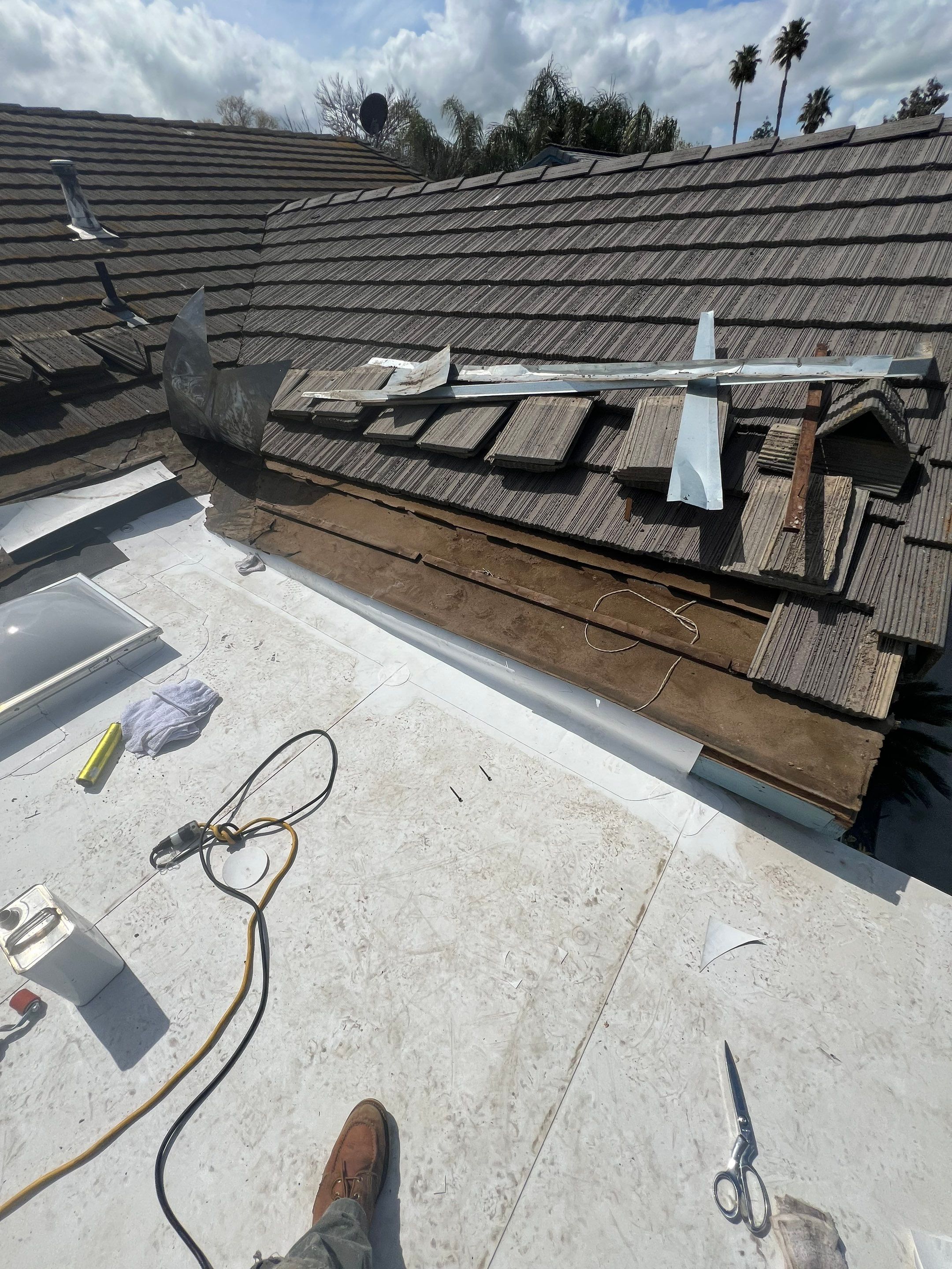 Single-ply roofing system on porch using TPO 60 mil by Straight Edge Roofing Inc