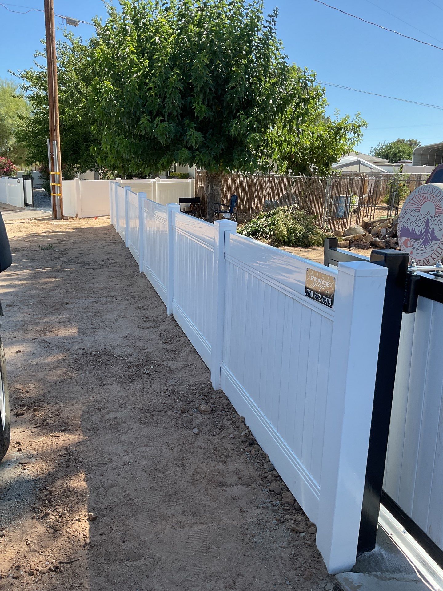 4ft White Vinyl Fence with Solar Power Motorized Gate by Fence Guys Inc.