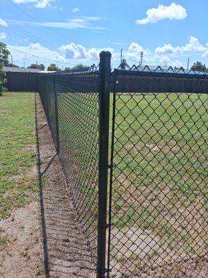 Black Chain Link Fence Installation for Residential Backyard in Port Charlotte