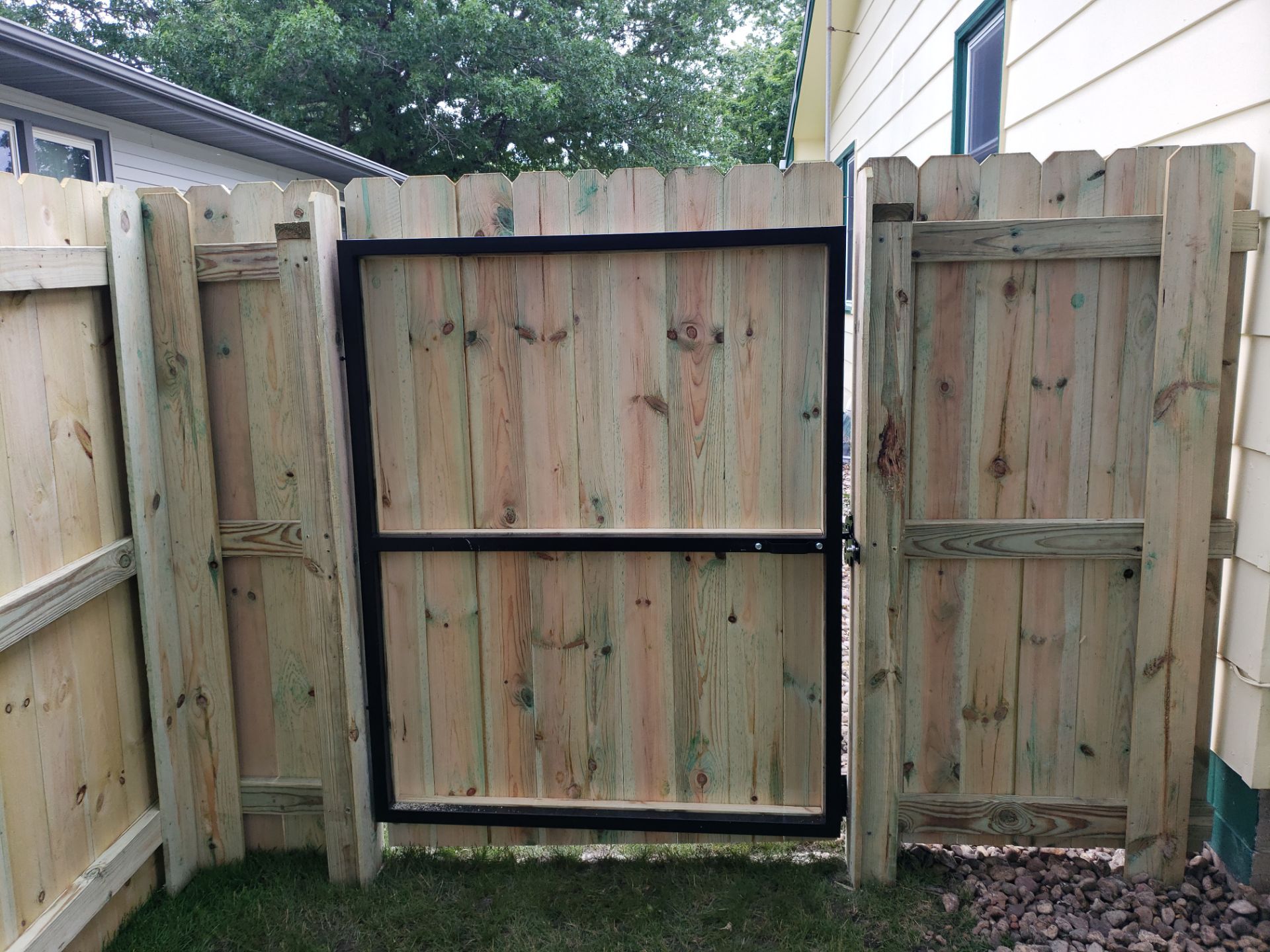 Custom Wood Privacy Fence Installation for Charles City Backyard by Perfect Picket Fence and Stain