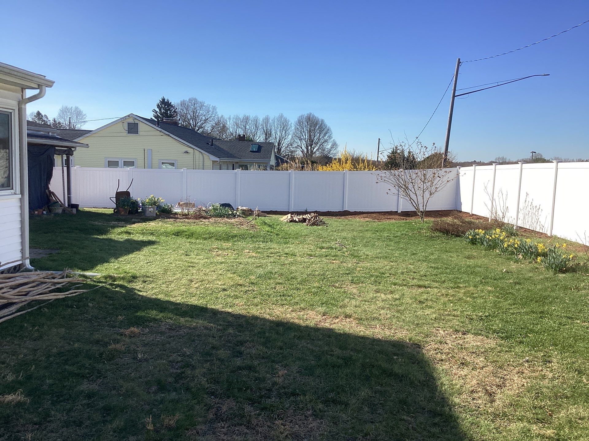 Fence replacement using White Vinyl Privacy with matching Gates.  by DiGiorgi Roofing and Siding Inc