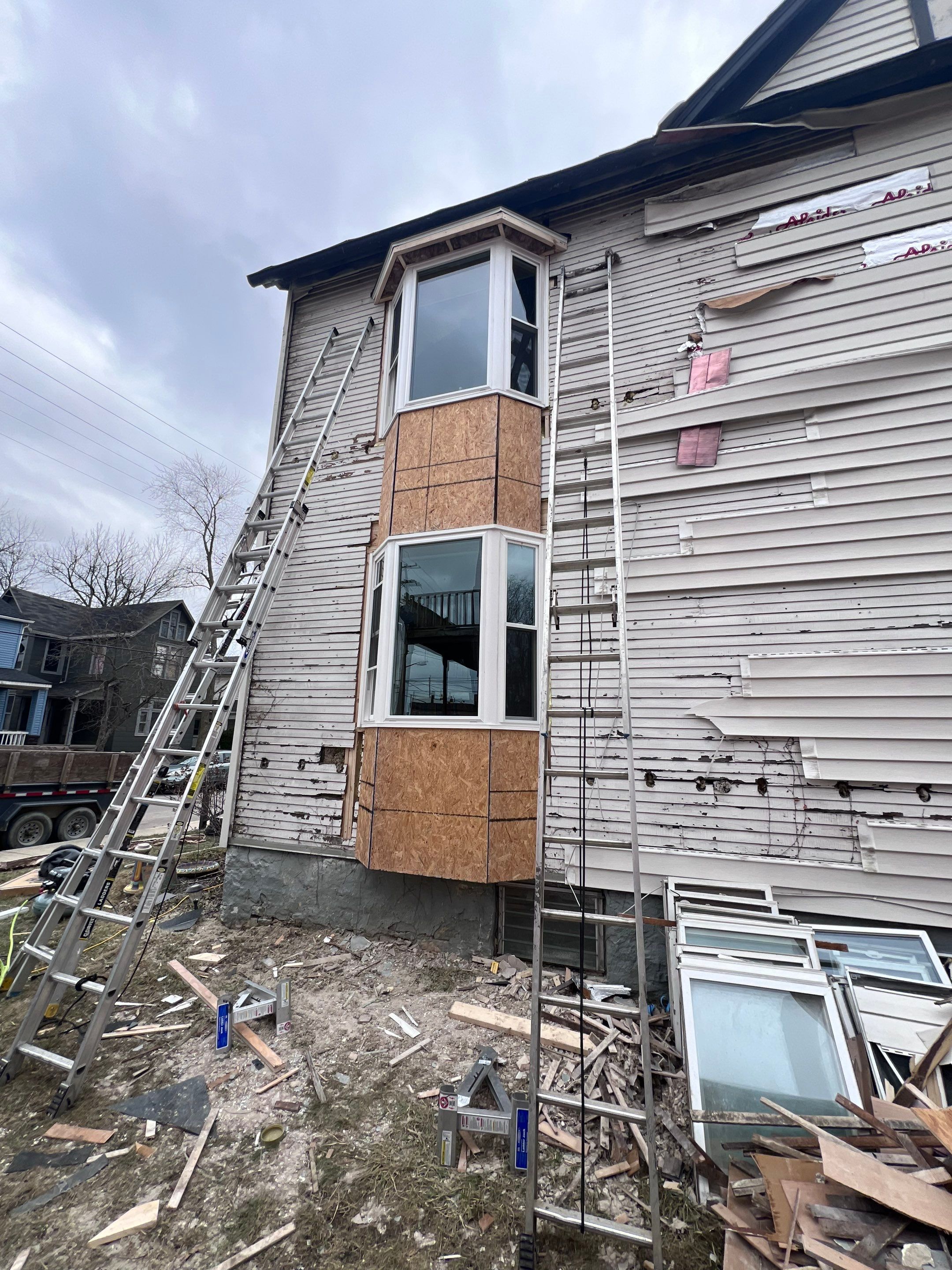New siding and new windows  by Know-A-Guy Roofing & Exteriors 