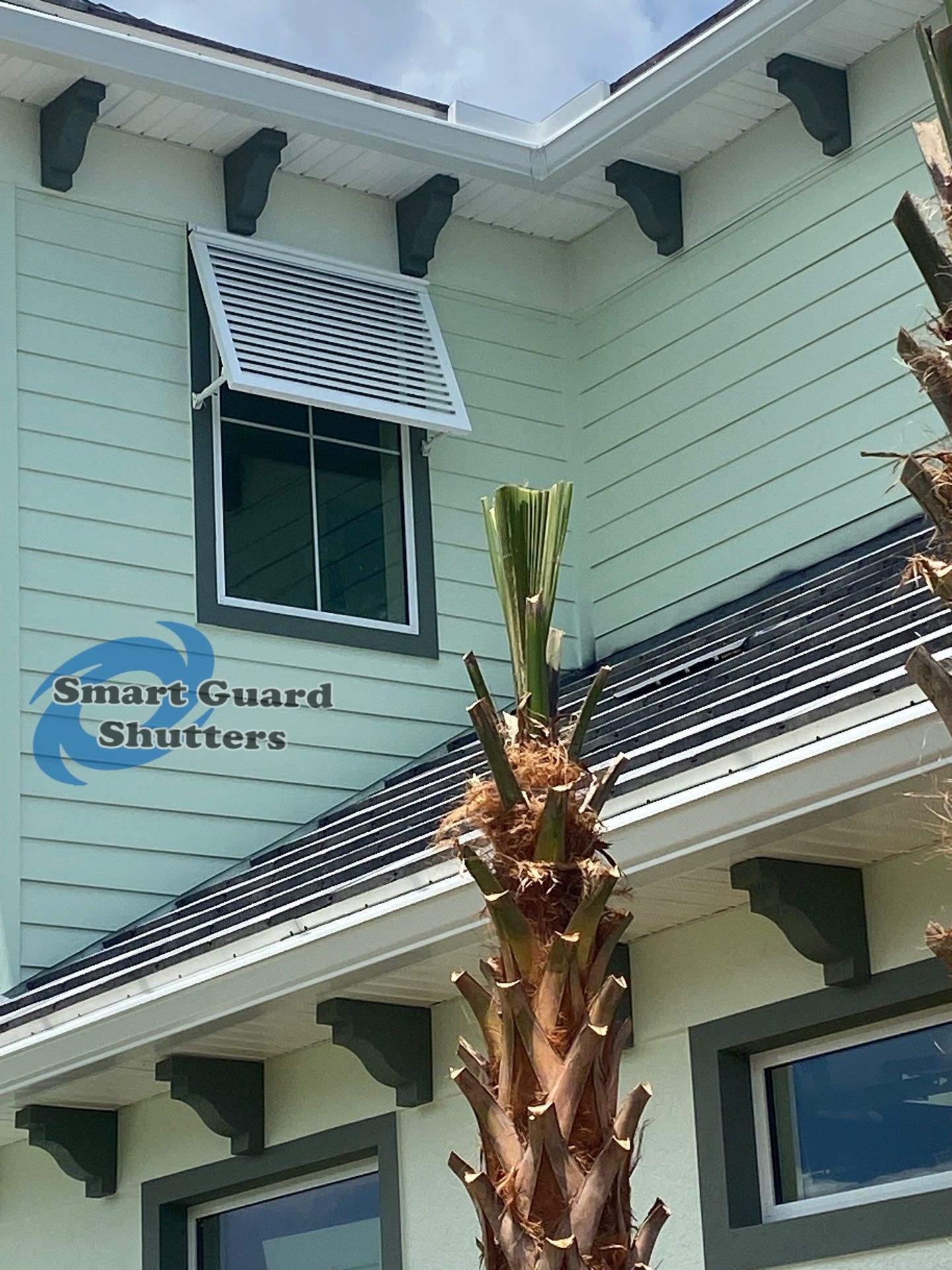 Decorative Bahama Shutters in Traffic White by Smart Guard Shutters