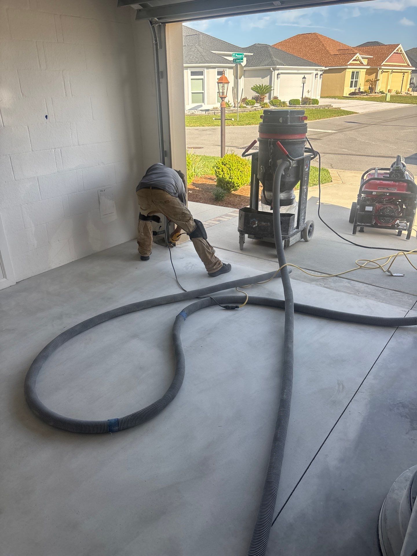 Garage and Lanai With Exterior Pad in Sandstone  by Innovative Concrete Coatings 