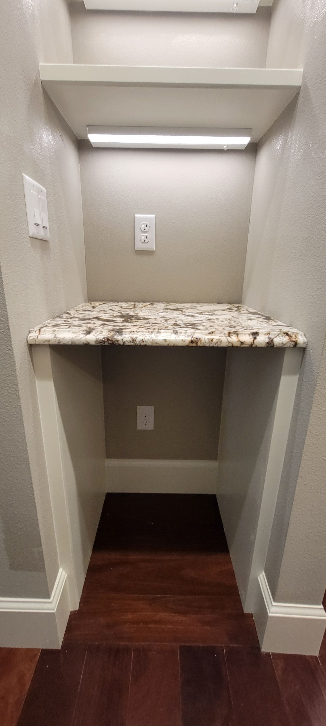 Closet transformation to coffee nook with custom shelves and LED lighting. by Crm Services Llc