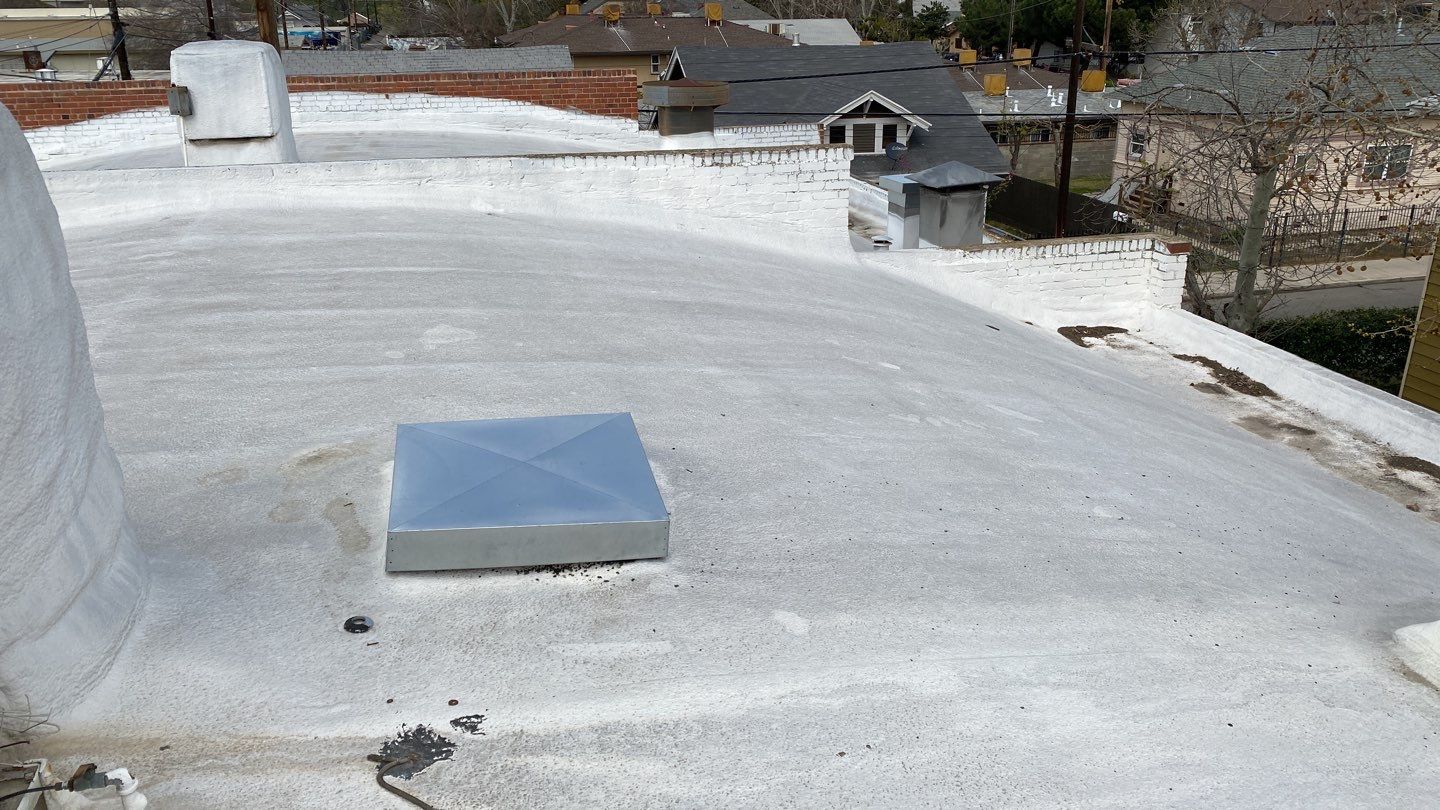 Polyurethane foam roof refurbish and recoating by Straight Edge Roofing Inc