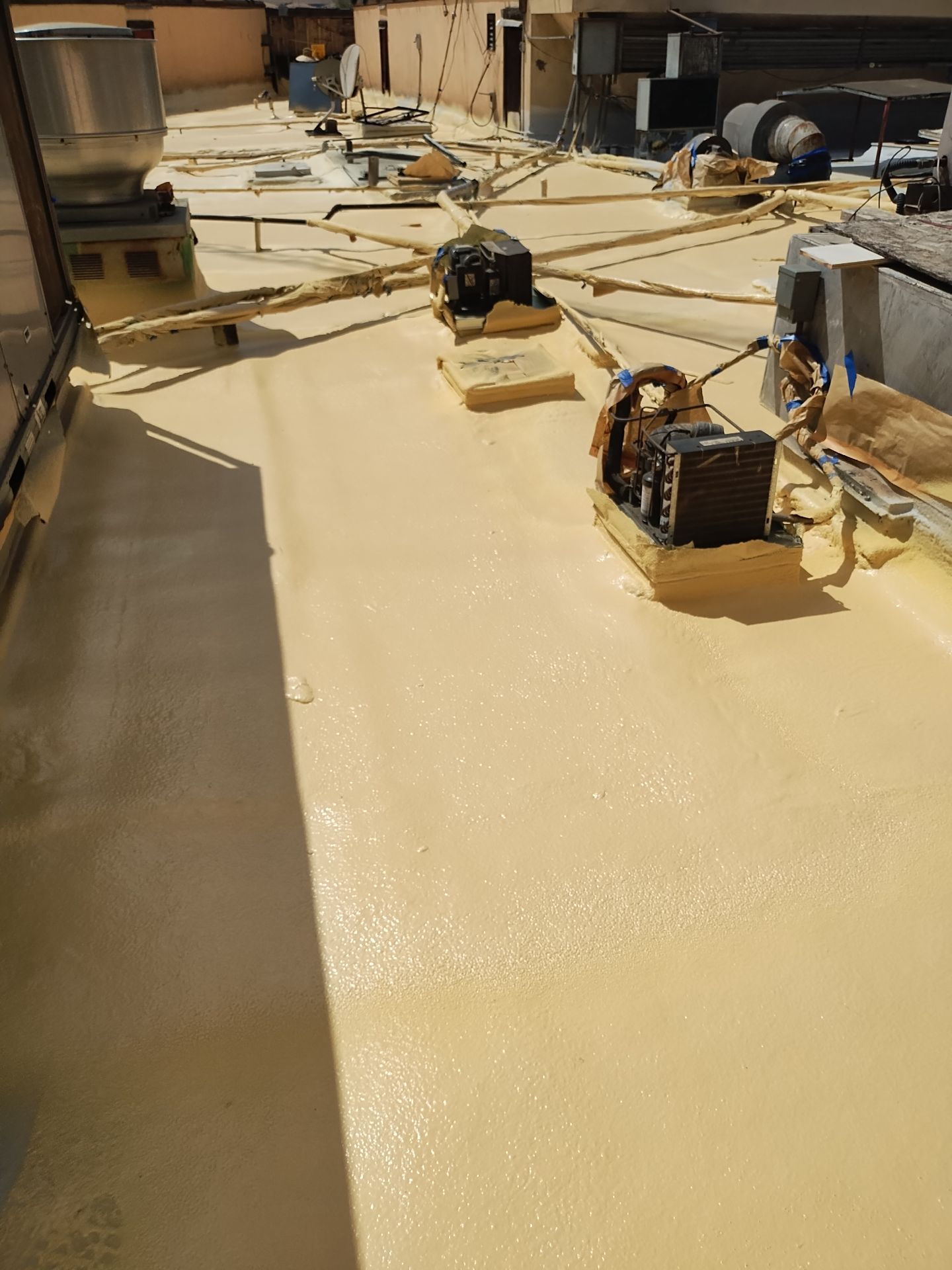 Spray foam and coatings using General Coatings acrylic coatings and spray foam by Straight Edge Roofing Inc