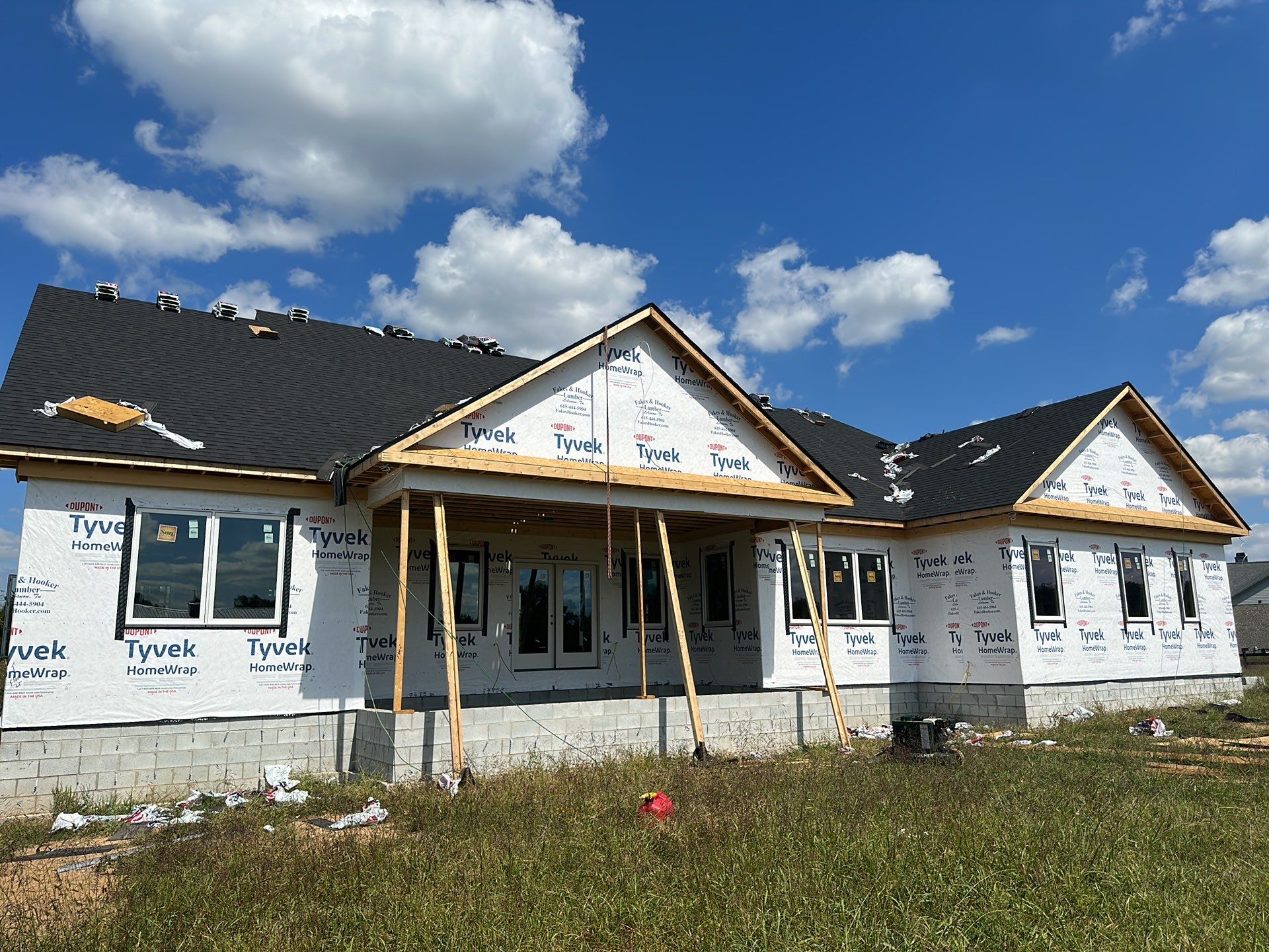 Residential Roofing Installation using Tamko Heritage AR with Standing Seam Metal Porch by Undersun Roofing 