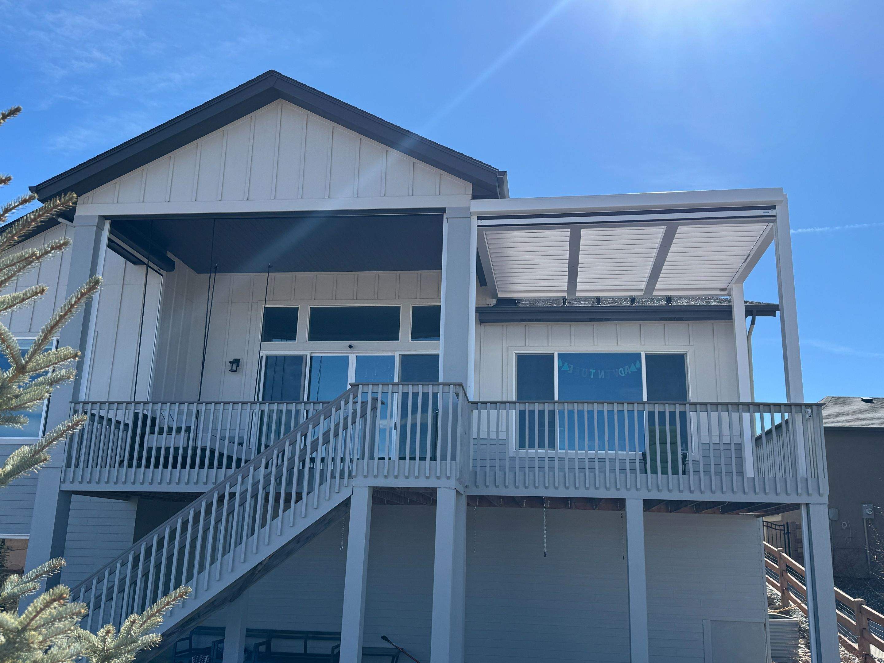 Aluminum Pergola using Azenco Outdoor with Motorized Exterior Screens by Outdoor Solutions Colorado
