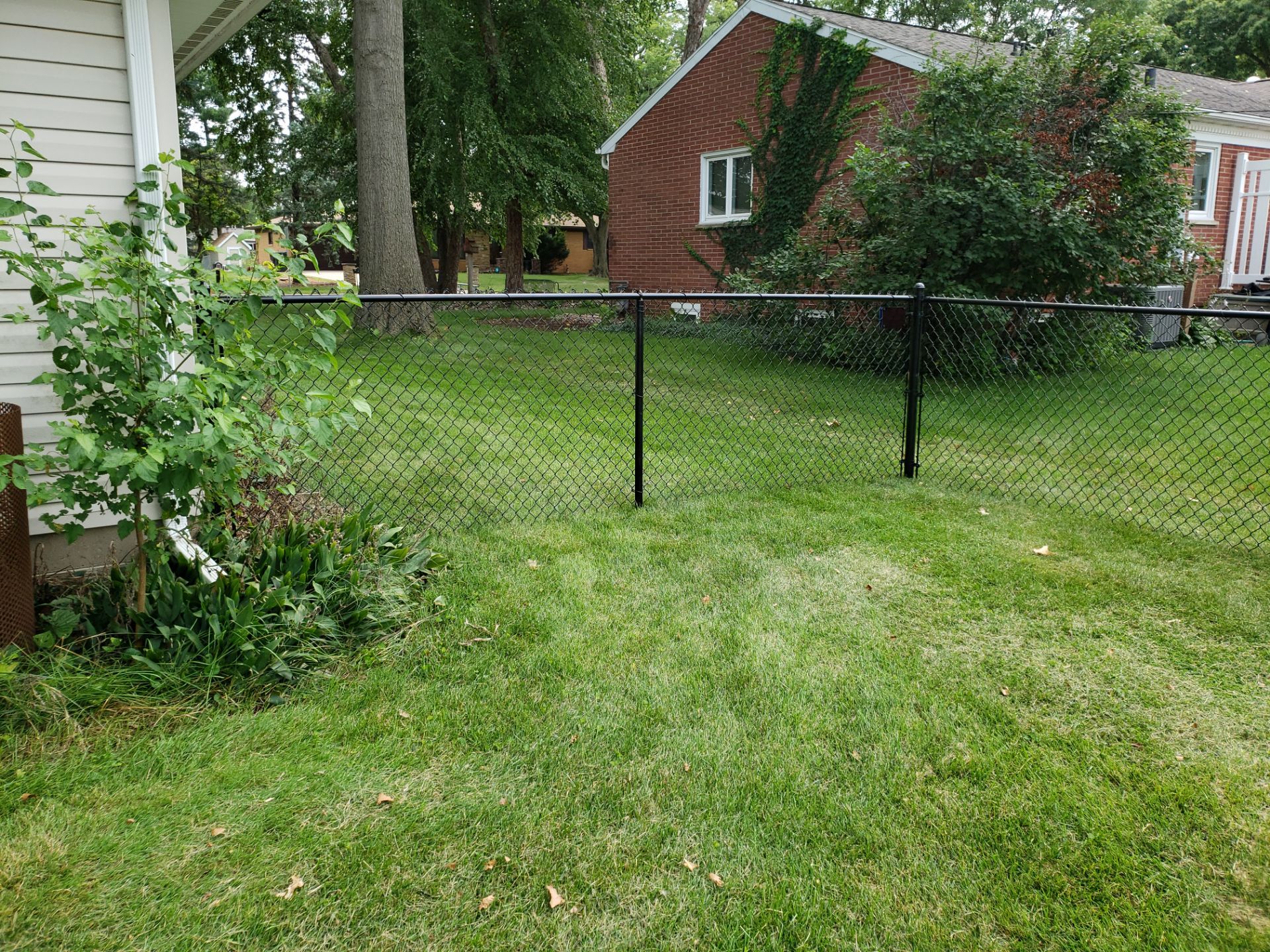 Black Chain Link Fence Installation in Cedar Falls by Perfect Picket Fence and Stain