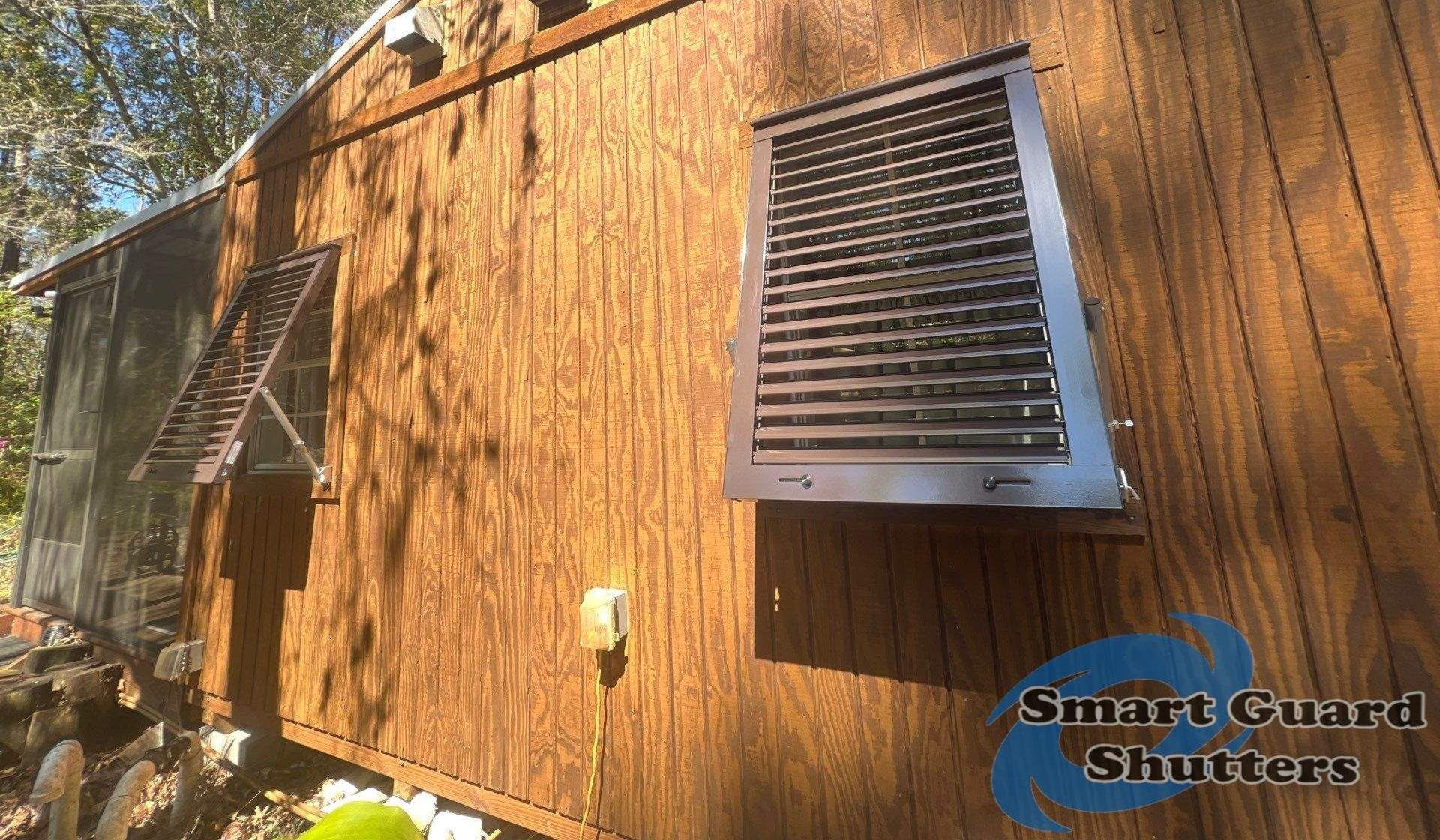 Hurricane Protection in Bronze/Grey Brown by Smart Guard Shutters