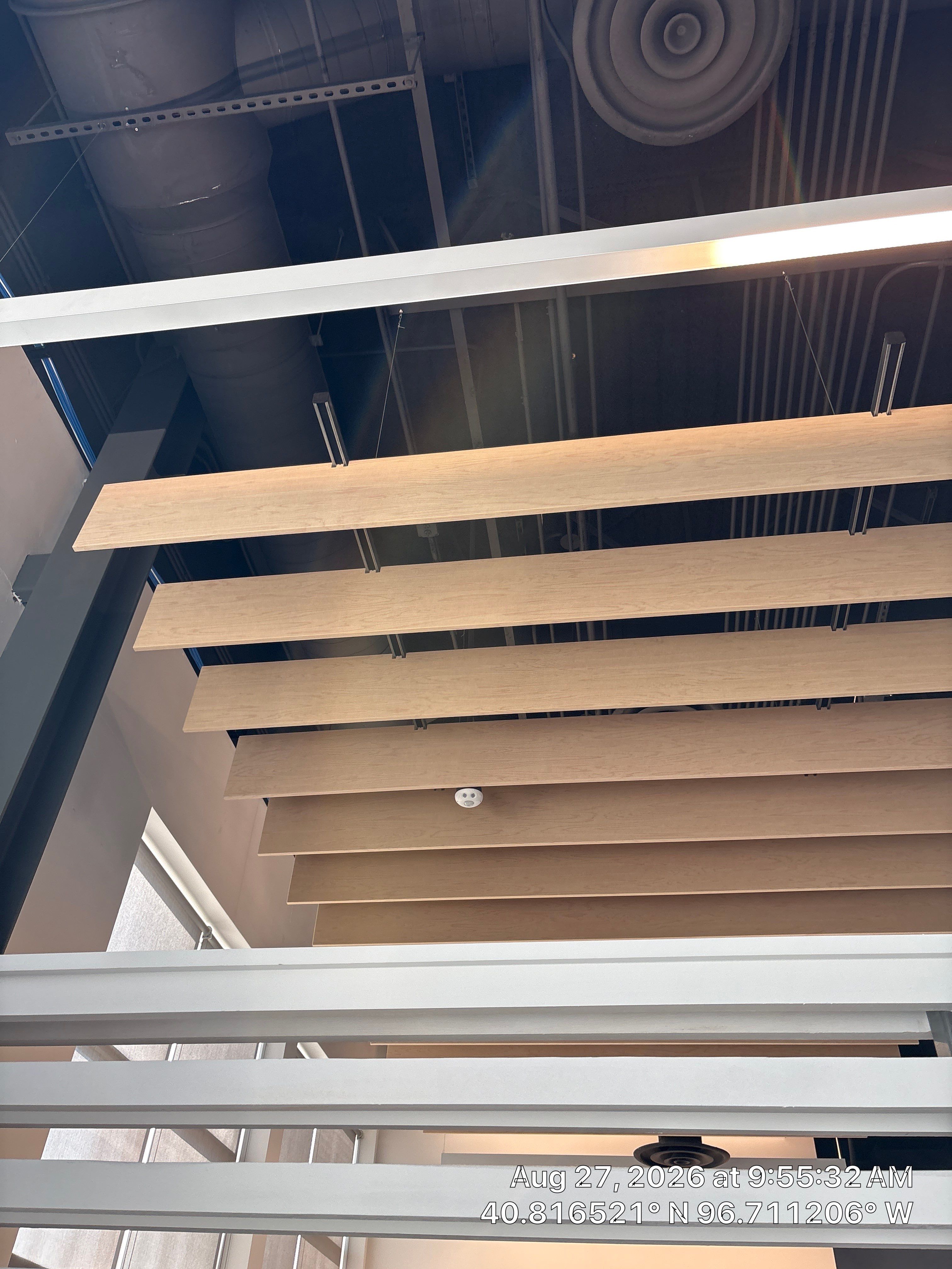 Modern Office Interior Renovation with Acoustic Wood Baffles in Lincoln by CompanyCam Sales Demo
