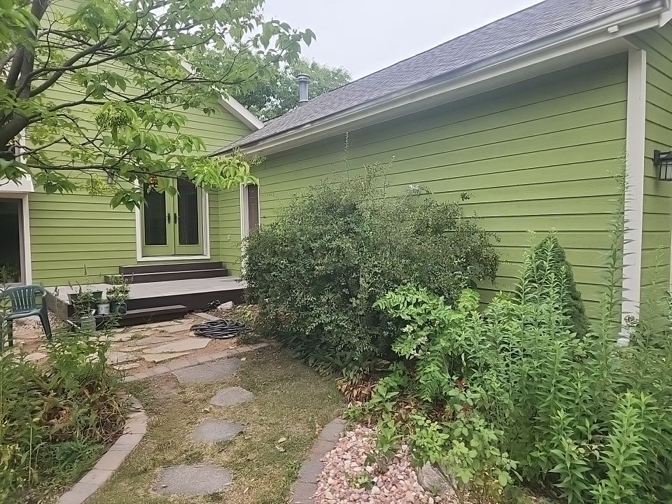 Complete house repaint to a different color  by Cutting edge painting 