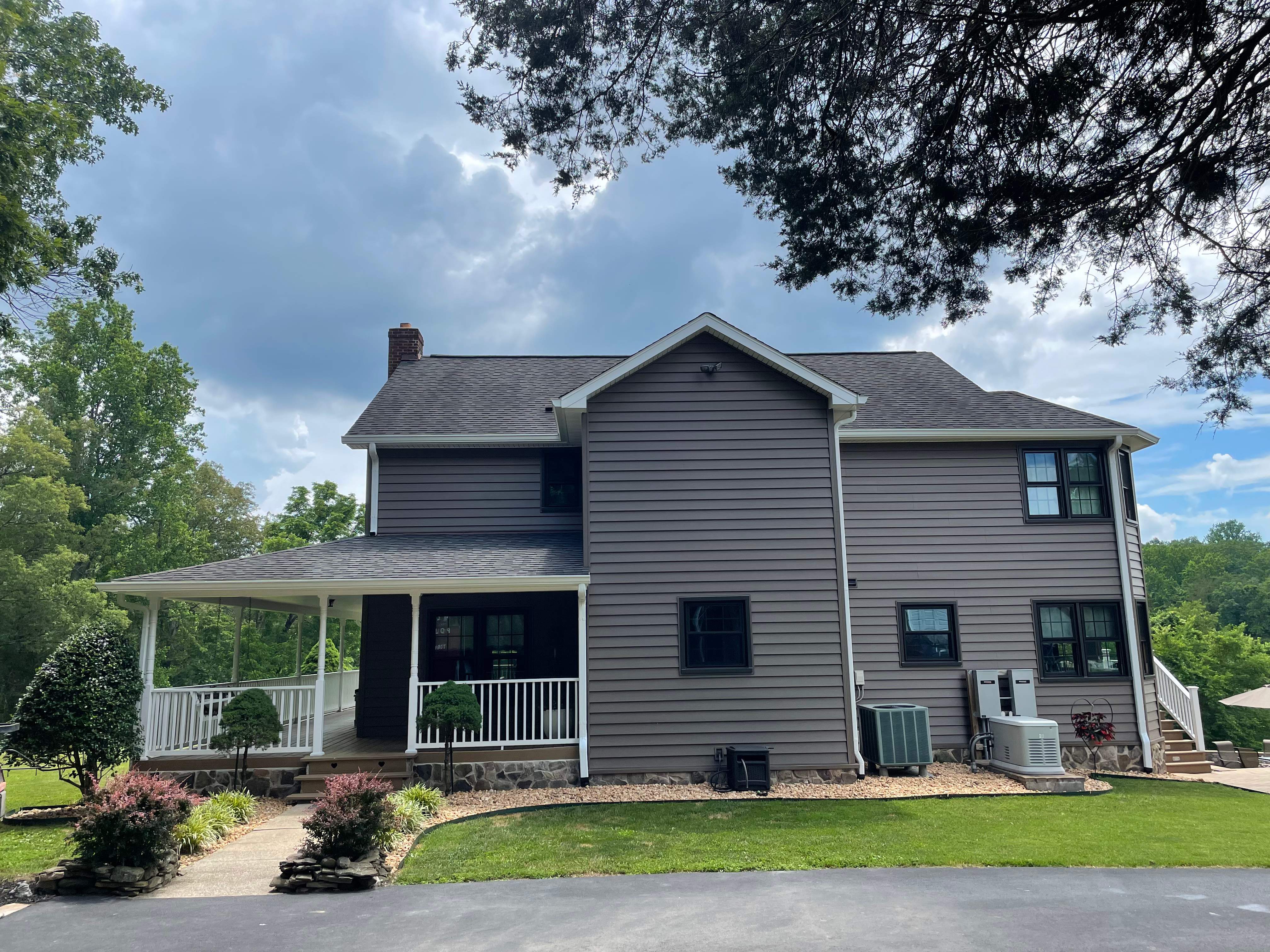 Exterior remodel including window replacement by American Home Contractors