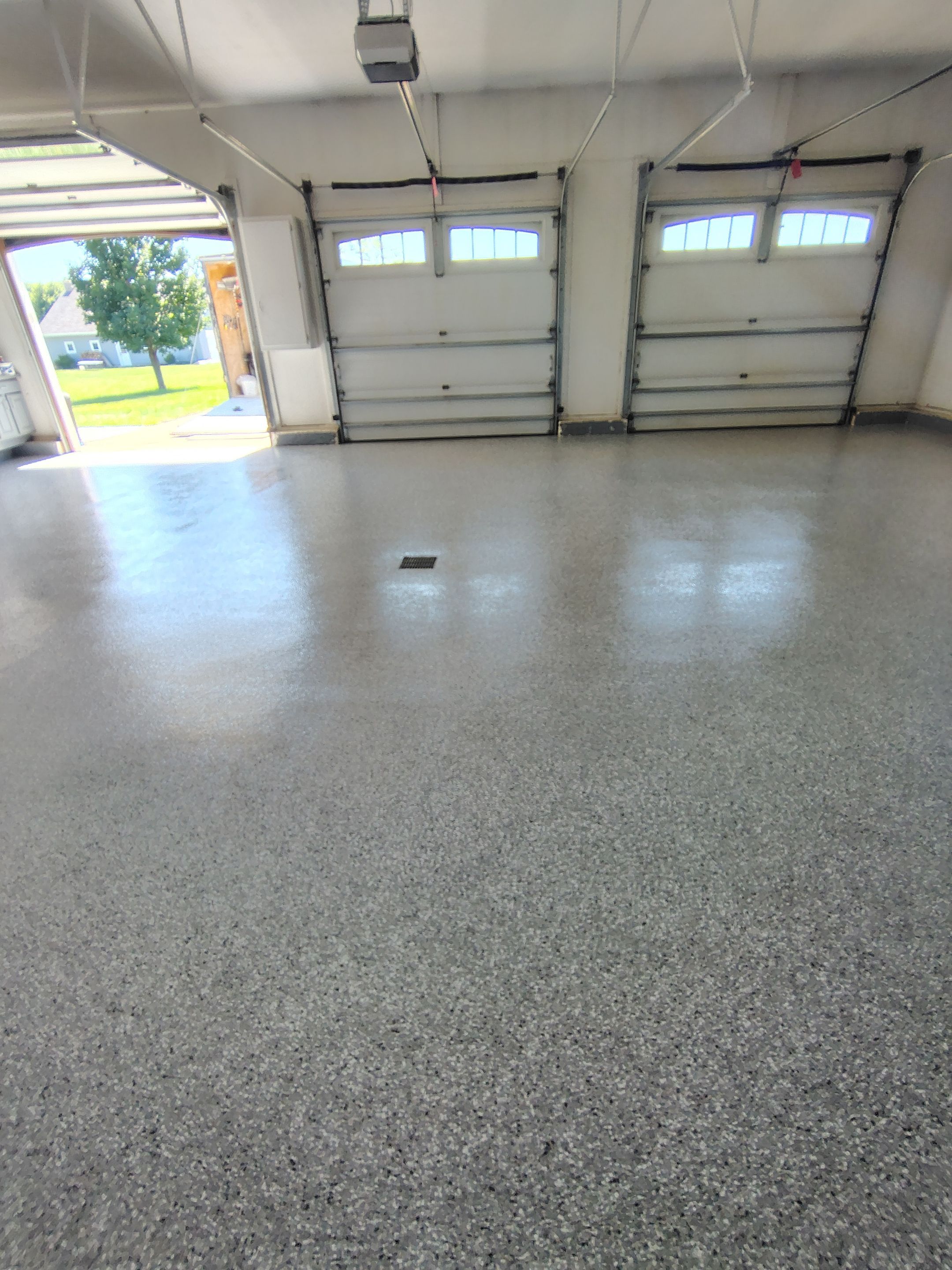 Feather Grey Garage Floor Coating Installation in Valley Springs by Select Painting, Coatings & Garage Cabinets