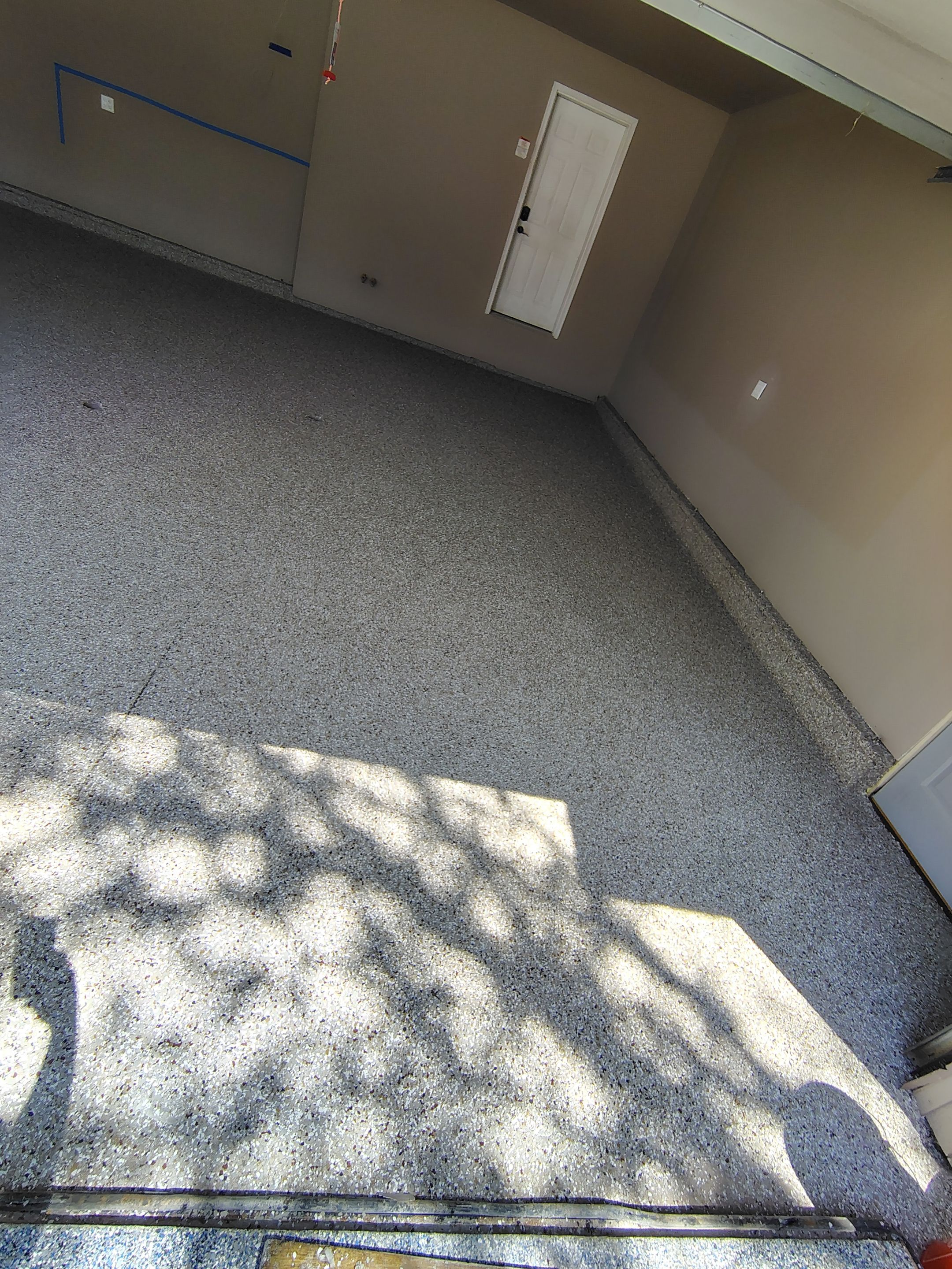 Sioux Falls Garage Concrete Repair and Epoxy Flake Floor Coating by Select Painting, Coatings & Garage Cabinets