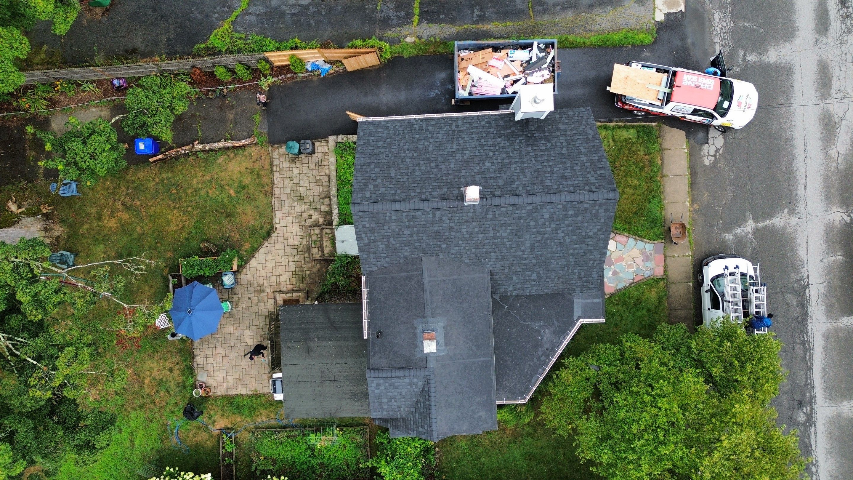 Full Roof Replacement + Custom Gutter Install | Onyx Black Finish by Mighty Dog Roofing of Greater Middlesex County