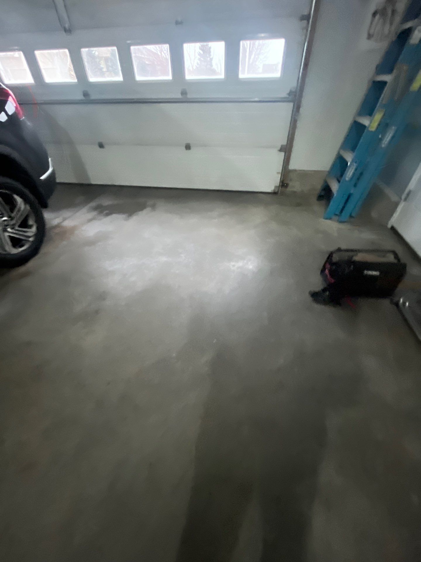 High-Gloss Epoxy Garage Floor Coating in Sioux Falls by Select Painting, Coatings & Garage Cabinets