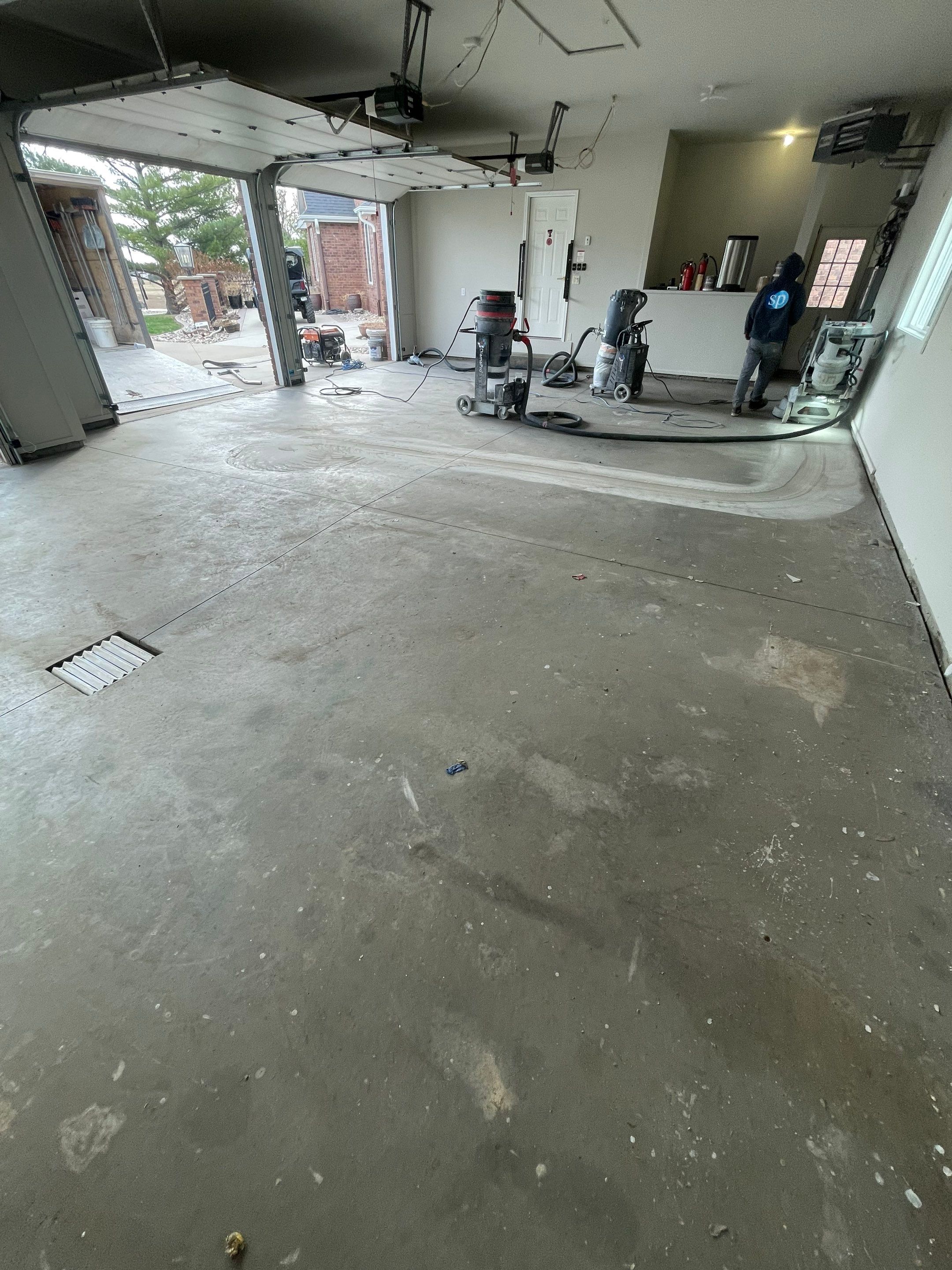 Garage transformation in Yankton by Select Painting, Coatings & Garage Cabinets